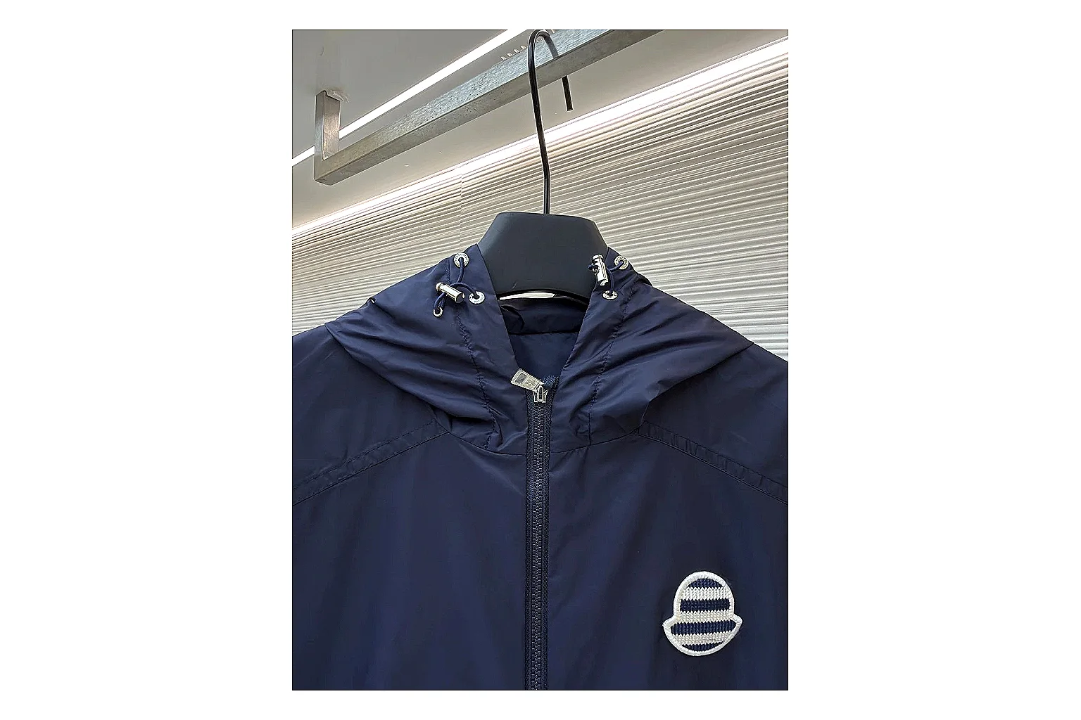Moncler Nylon Hooded Jacket Navy Jacket shopping brief image showing navy nylon hooded jacket with nylon texture, hood structure, zipper line, sleeve cuffs, and light shell shape thumbnail 4