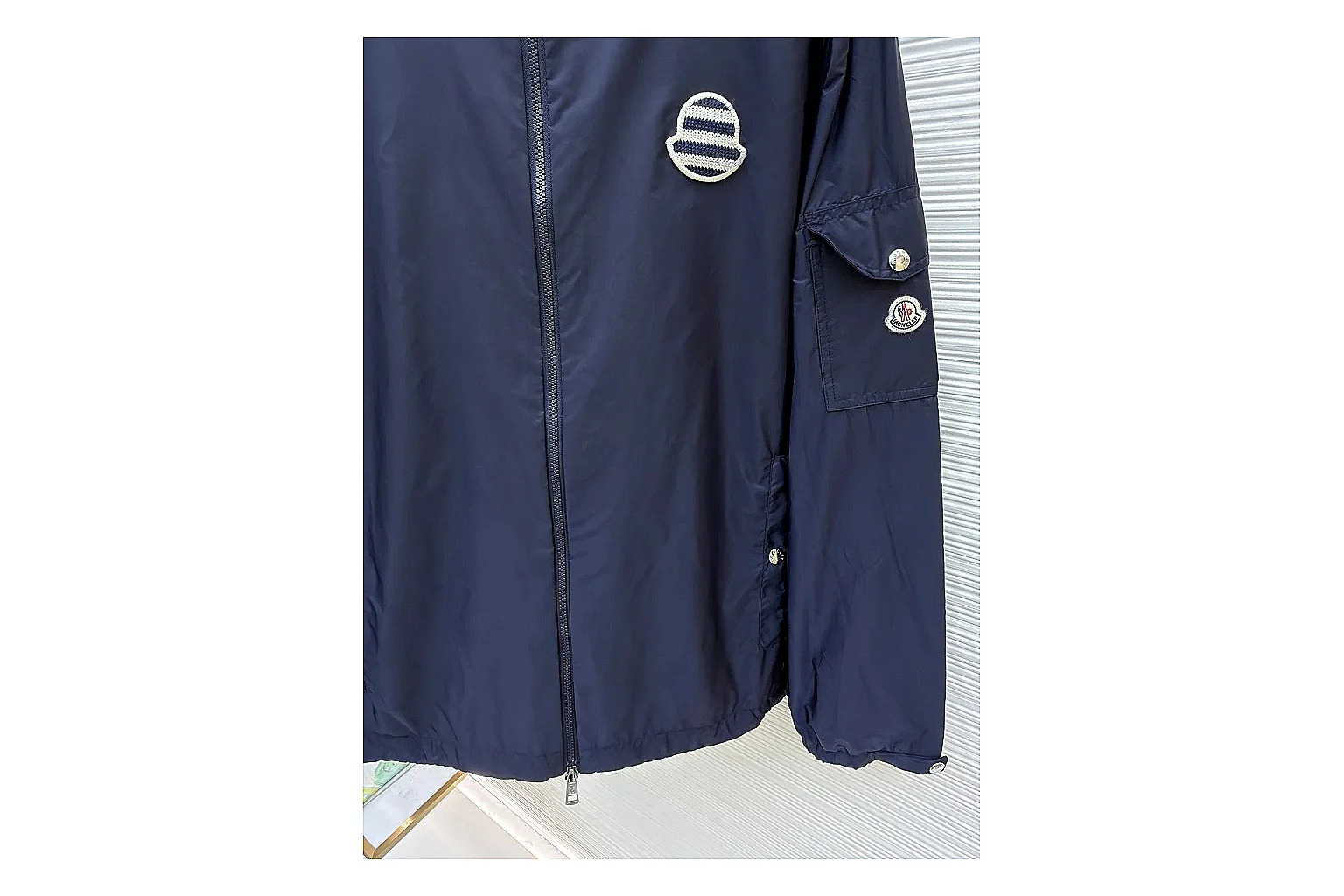 Moncler Nylon Hooded Jacket Navy Jacket shopping brief image showing navy nylon hooded jacket with nylon texture, hood structure, zipper line, sleeve cuffs, and light shell shape thumbnail 5