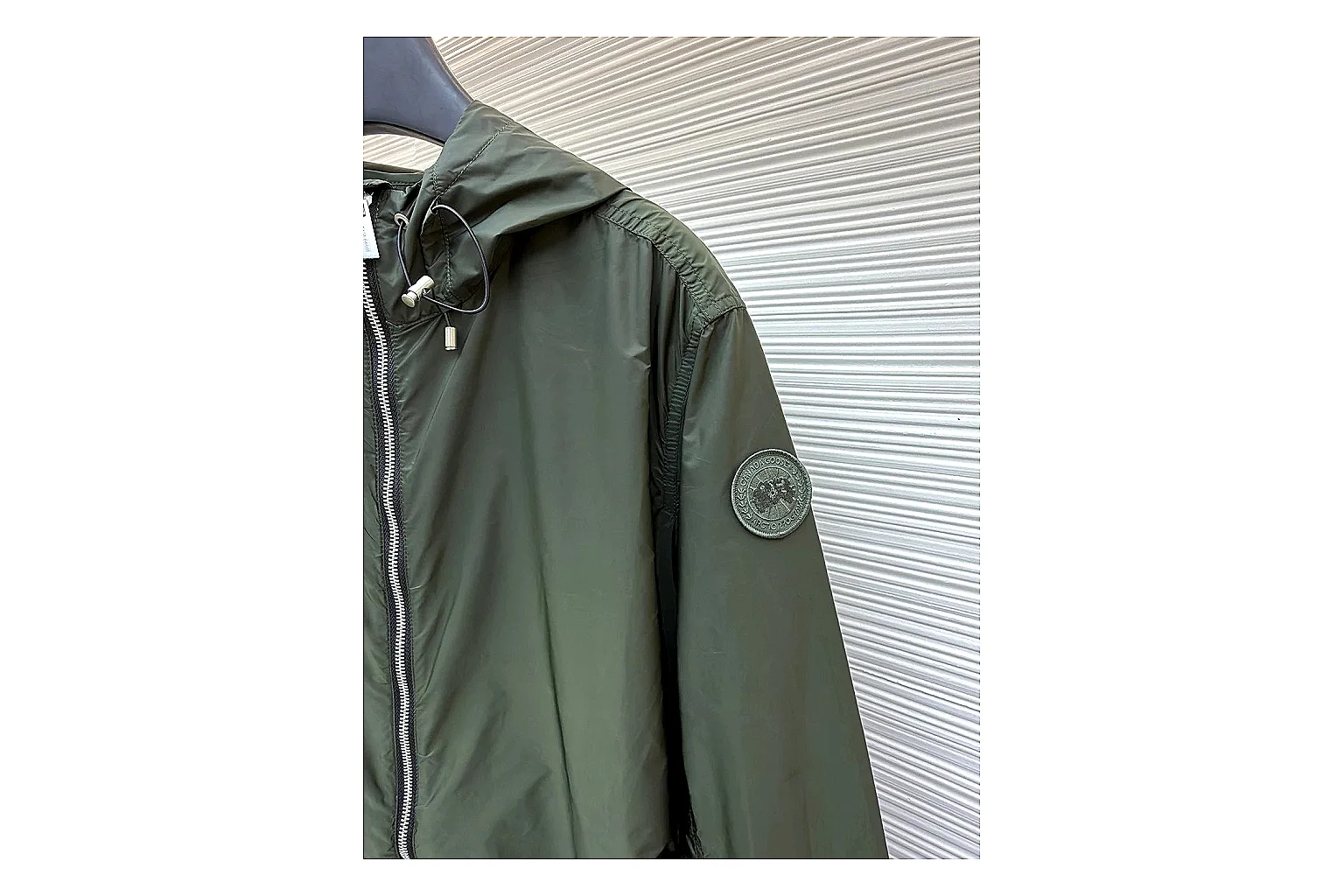 Moncler Nylon Hooded Jacket Olive Jacket shopping brief image showing olive nylon hooded jacket with nylon texture, hood structure, zipper line, sleeve cuffs, and light shell shape thumbnail 3