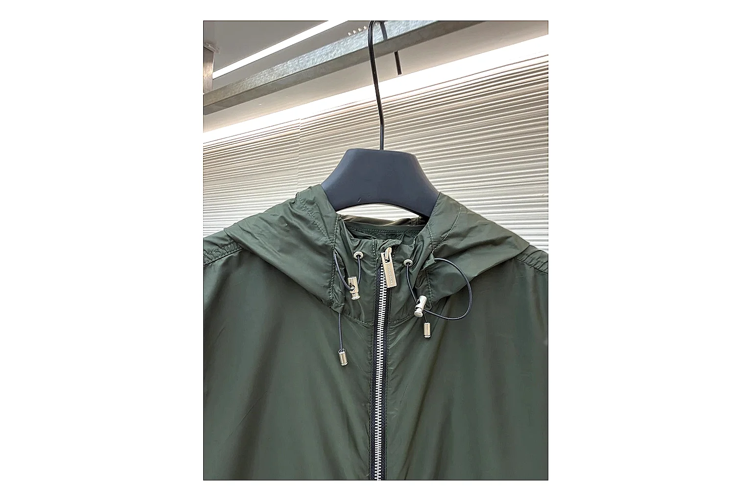 Moncler Nylon Hooded Jacket Olive Jacket shopping brief image showing olive nylon hooded jacket with nylon texture, hood structure, zipper line, sleeve cuffs, and light shell shape thumbnail 4