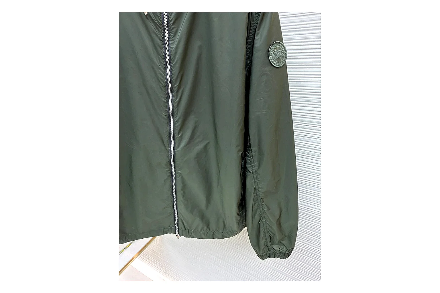 Moncler Nylon Hooded Jacket Olive Jacket shopping brief image showing olive nylon hooded jacket with nylon texture, hood structure, zipper line, sleeve cuffs, and light shell shape thumbnail 5