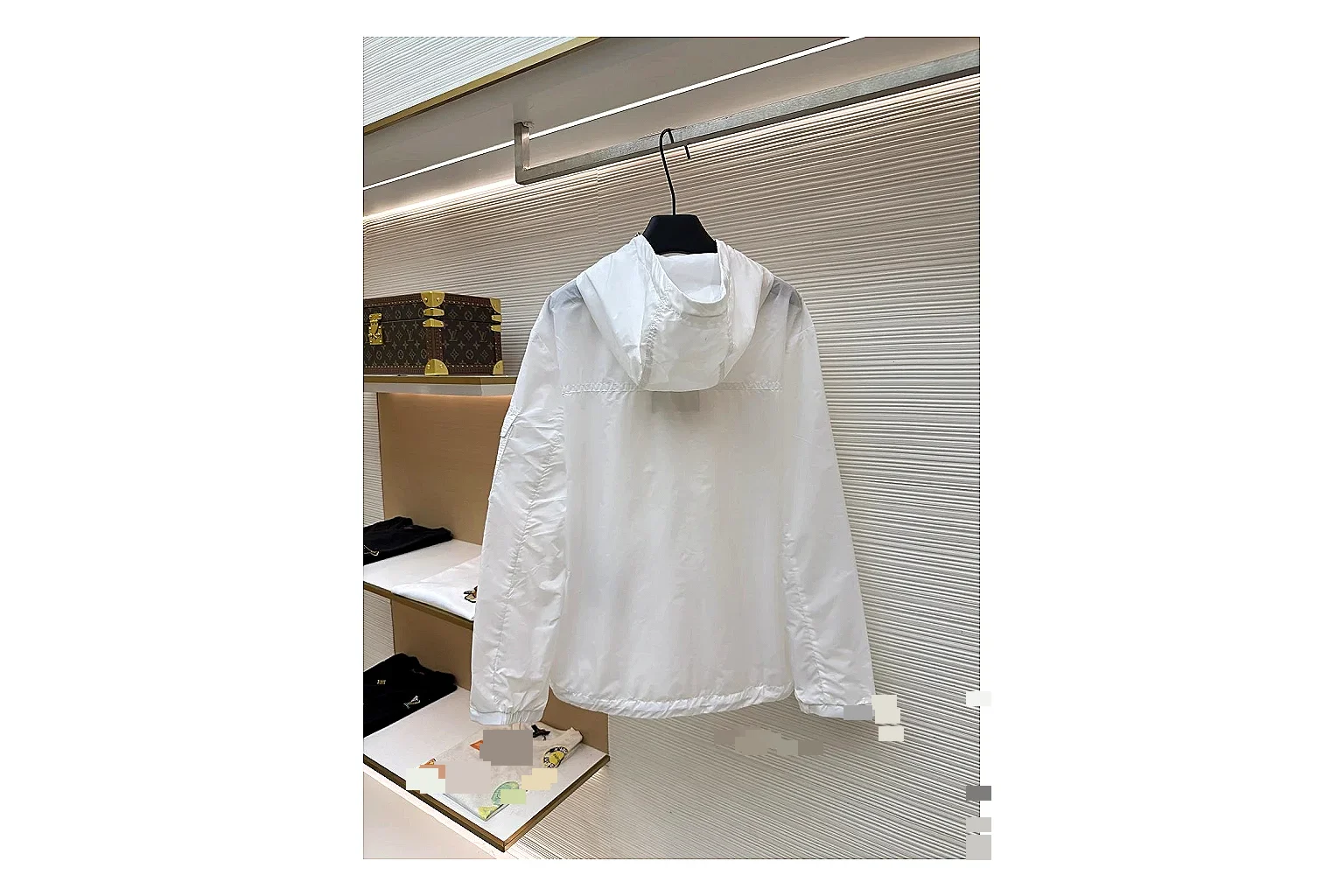 Moncler Nylon Hooded Jacket White Jacket shopping brief image showing white nylon hooded jacket with nylon texture, hood structure, zipper line, sleeve cuffs, and light shell shape