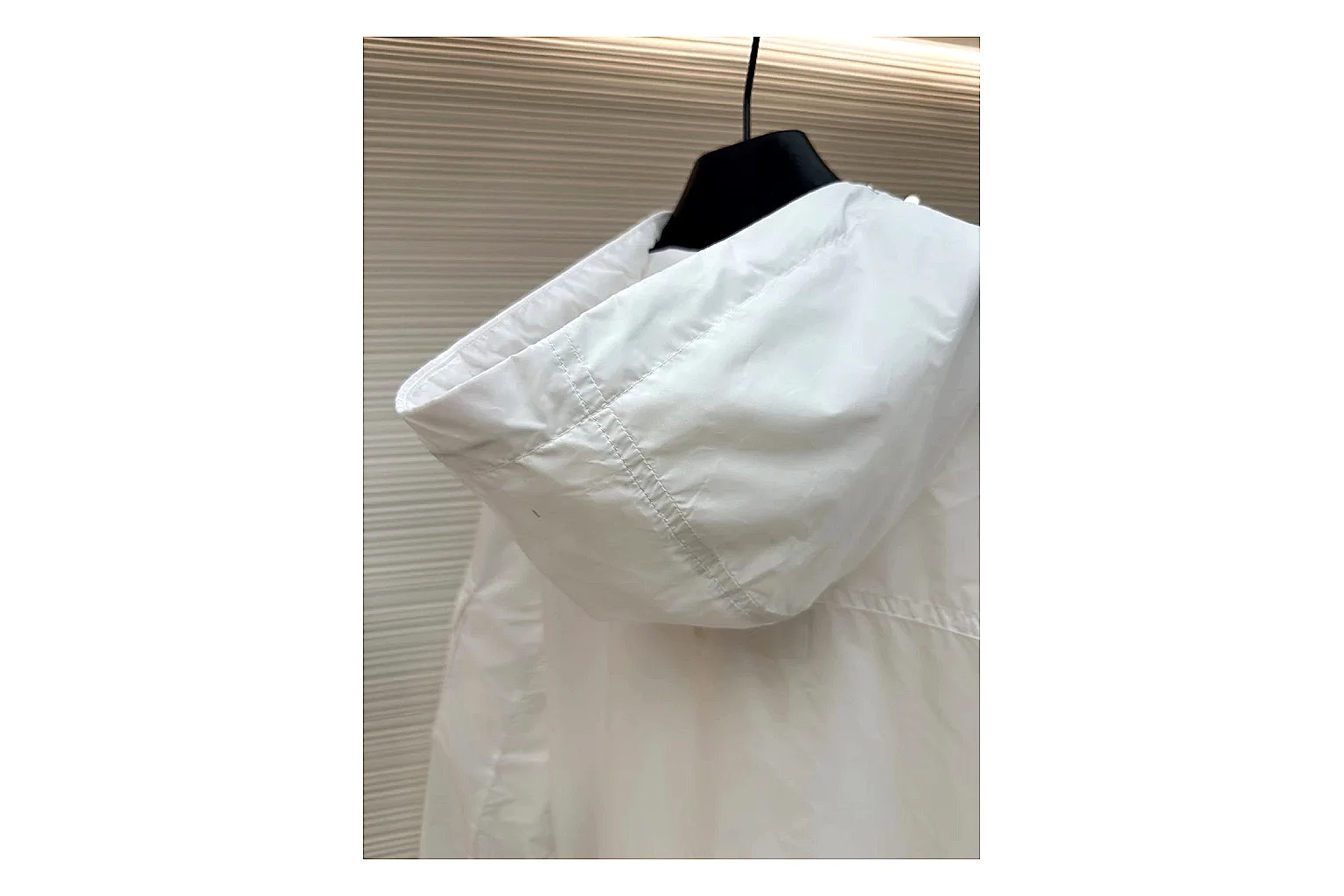 Moncler Nylon Hooded Jacket White Jacket shopping brief image showing white nylon hooded jacket with nylon texture, hood structure, zipper line, sleeve cuffs, and light shell shape thumbnail 2