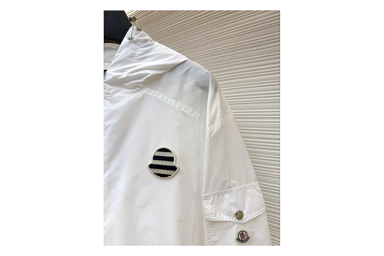 Moncler Nylon Hooded Jacket White Jacket shopping brief image showing white nylon hooded jacket with nylon texture, hood structure, zipper line, sleeve cuffs, and light shell shape thumbnail 3