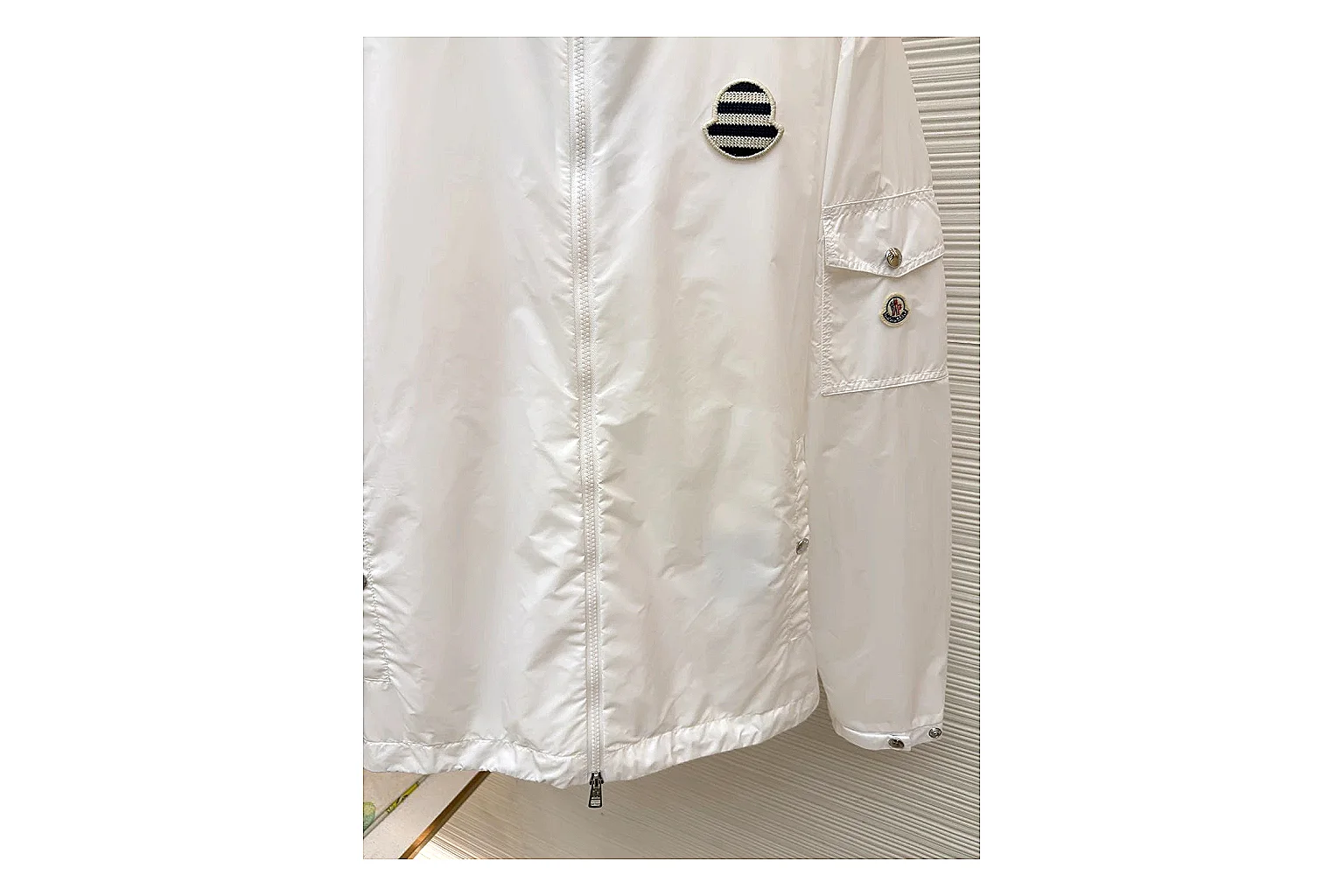 Moncler Nylon Hooded Jacket White Jacket shopping brief image showing white nylon hooded jacket with nylon texture, hood structure, zipper line, sleeve cuffs, and light shell shape thumbnail 5