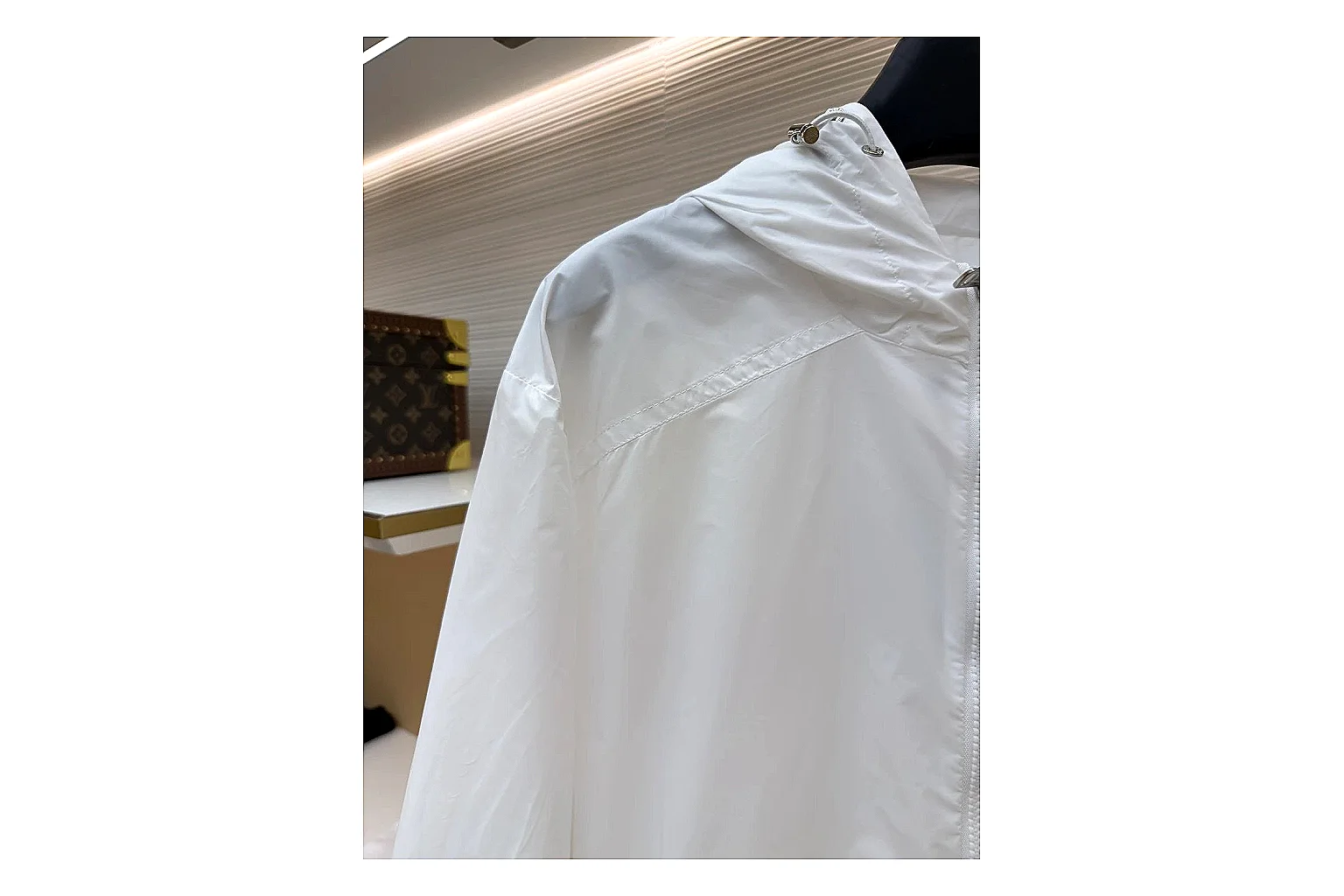 Moncler Nylon Hooded Jacket White Jacket shopping brief image showing white nylon hooded jacket with nylon texture, hood structure, zipper line, sleeve cuffs, and light shell shape thumbnail 6