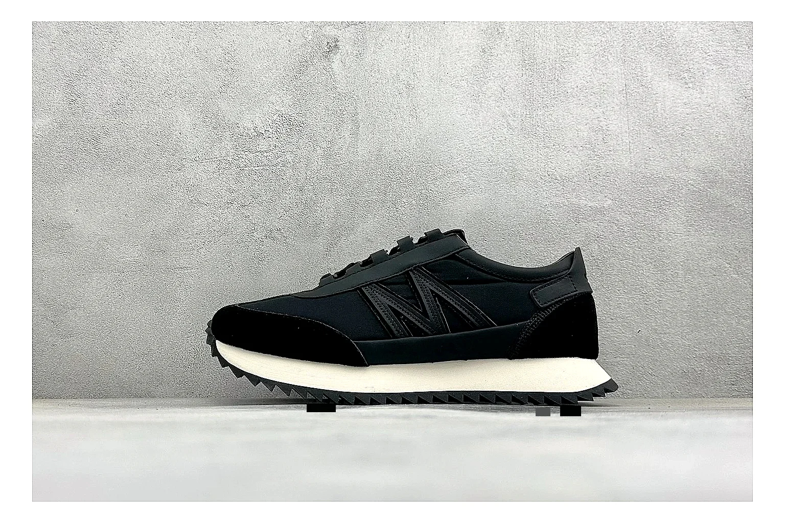 Moncler Pacey Black White shopping brief image showing black upper, white rugged outsole, low padded collar, and outdoor-leaning tread profile