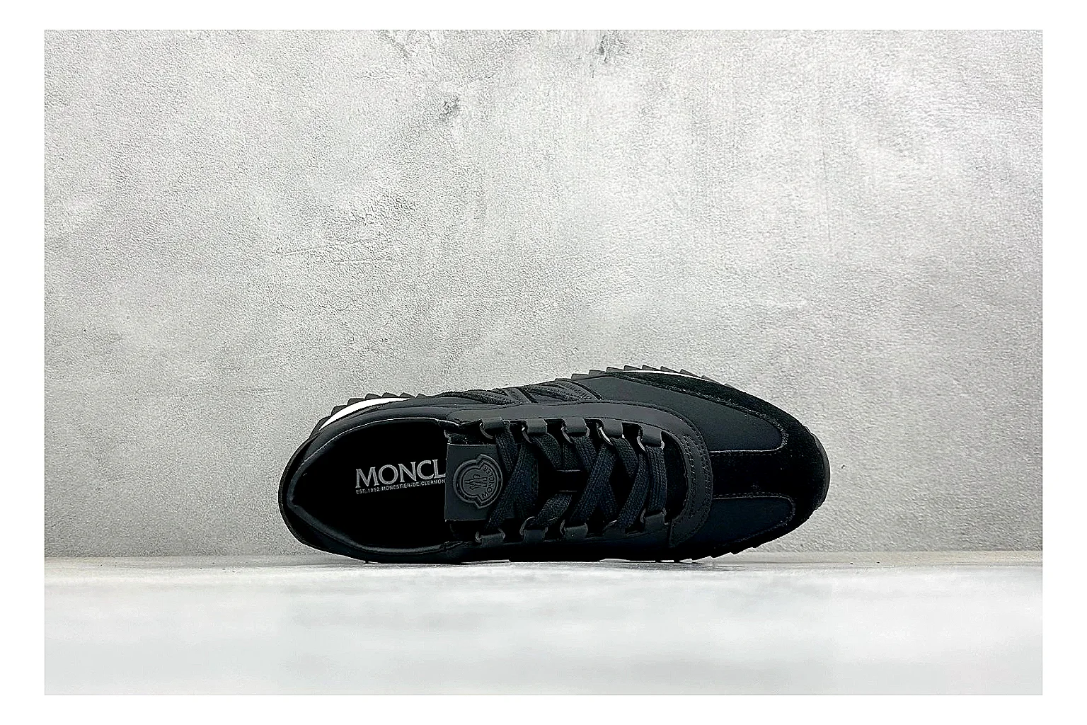Moncler Pacey Black White shopping brief image showing black upper, white rugged outsole, low padded collar, and outdoor-leaning tread profile thumbnail 5