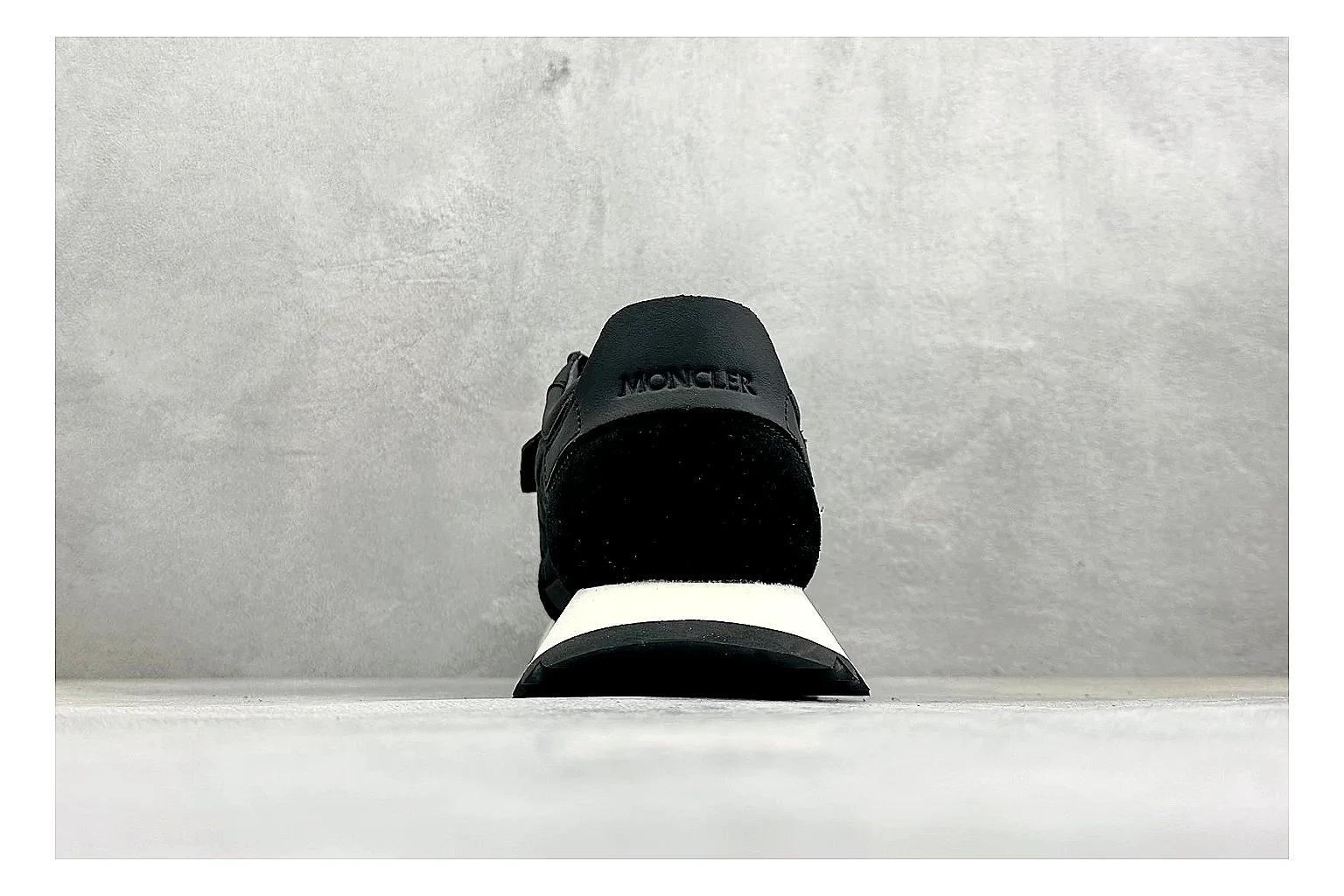 Moncler Pacey Black White shopping brief image showing black upper, white rugged outsole, low padded collar, and outdoor-leaning tread profile thumbnail 6