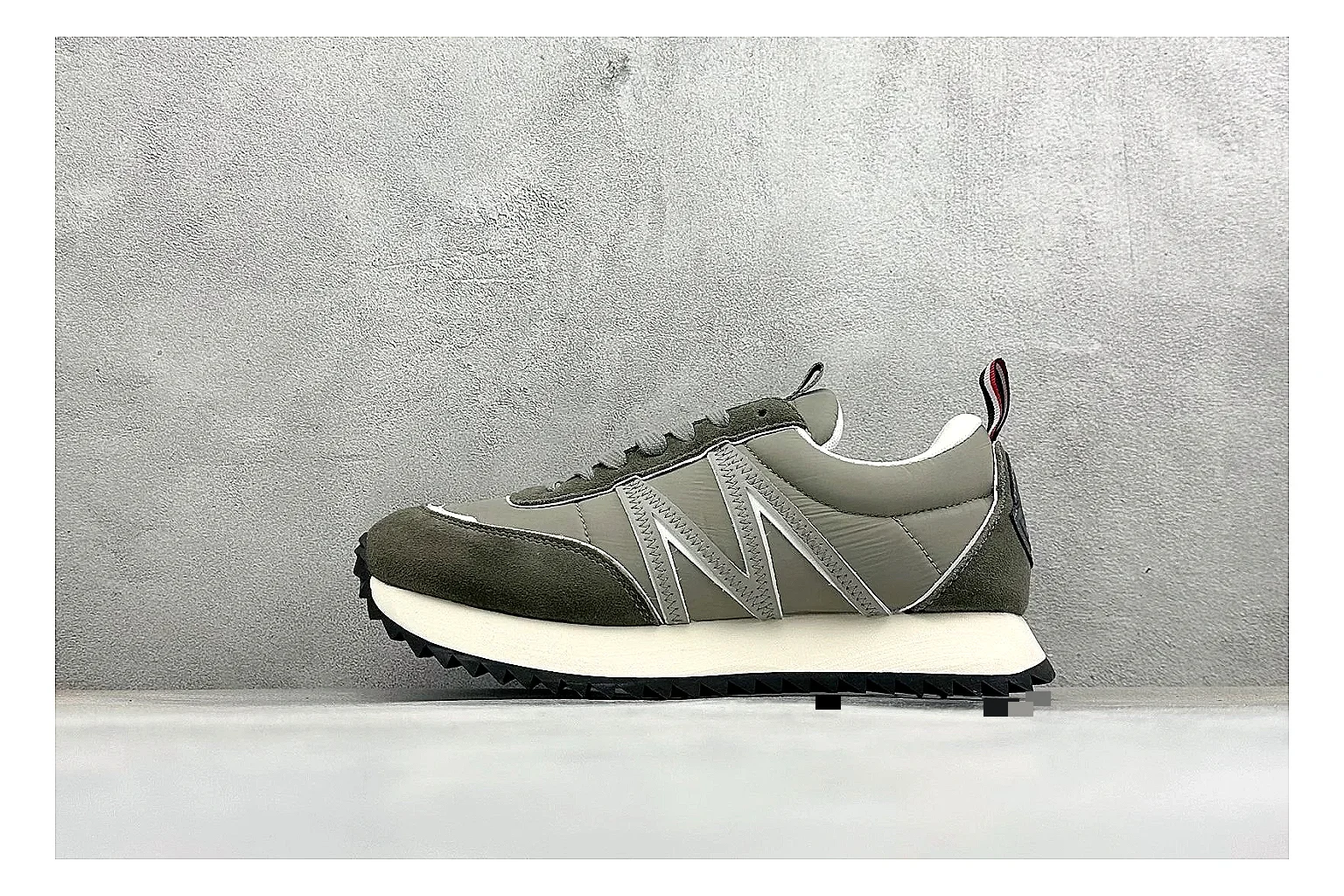 Moncler Pacey Grey Suede shopping brief image showing grey suede upper, rugged white outsole, low collar, and soft neutral streetwear tone