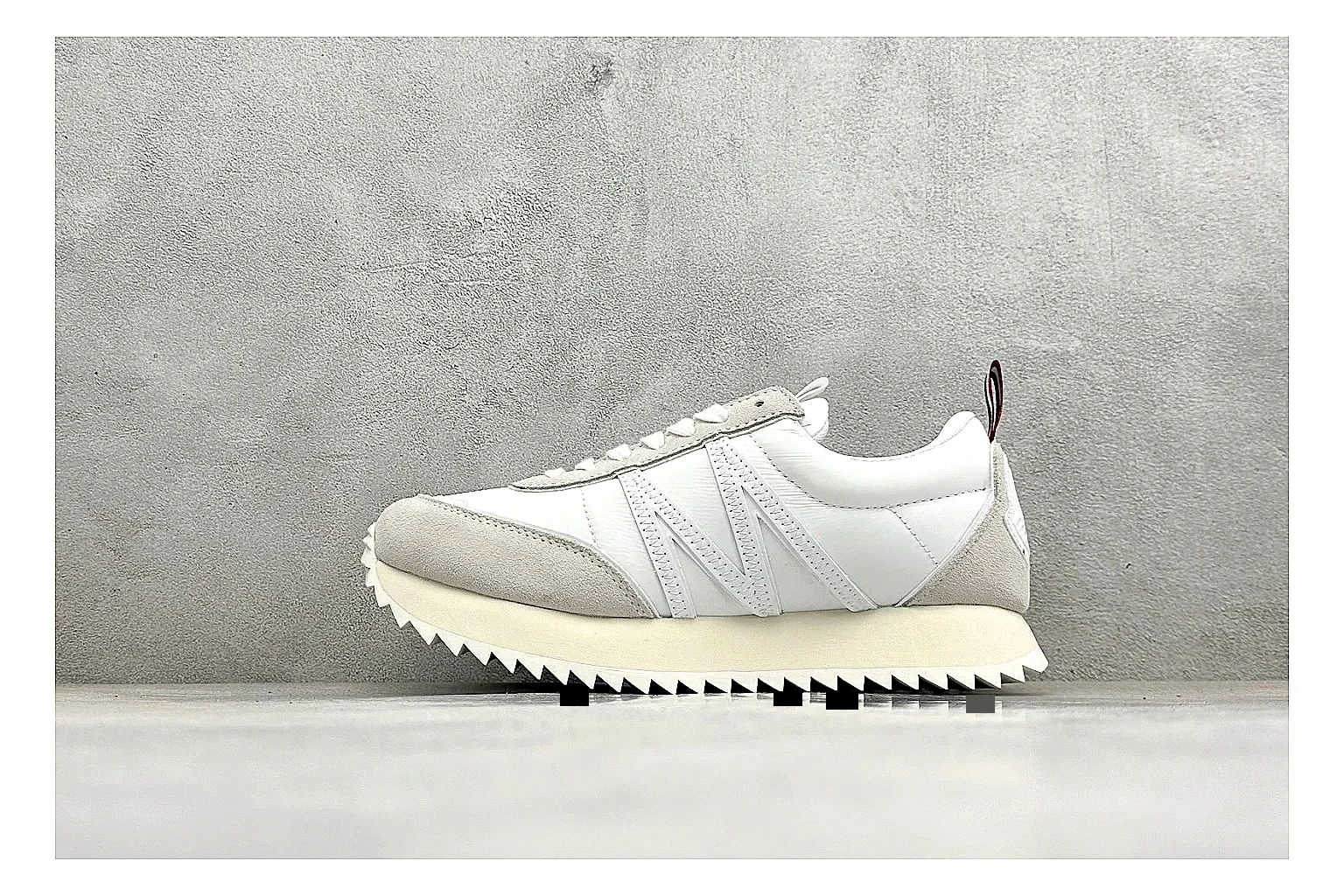 Moncler Pacey White Suede shopping brief image showing light suede upper, chunky serrated outsole, low padded collar, and tonal casual build
