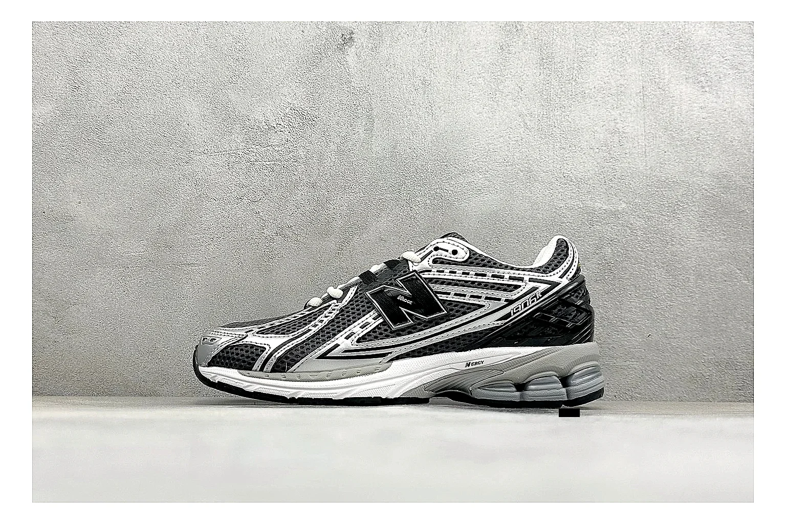 New Balance 1906 Black Silver shopping brief photo showing black mesh base, silver overlays, technical 1906 runner structure, and layered performance sole