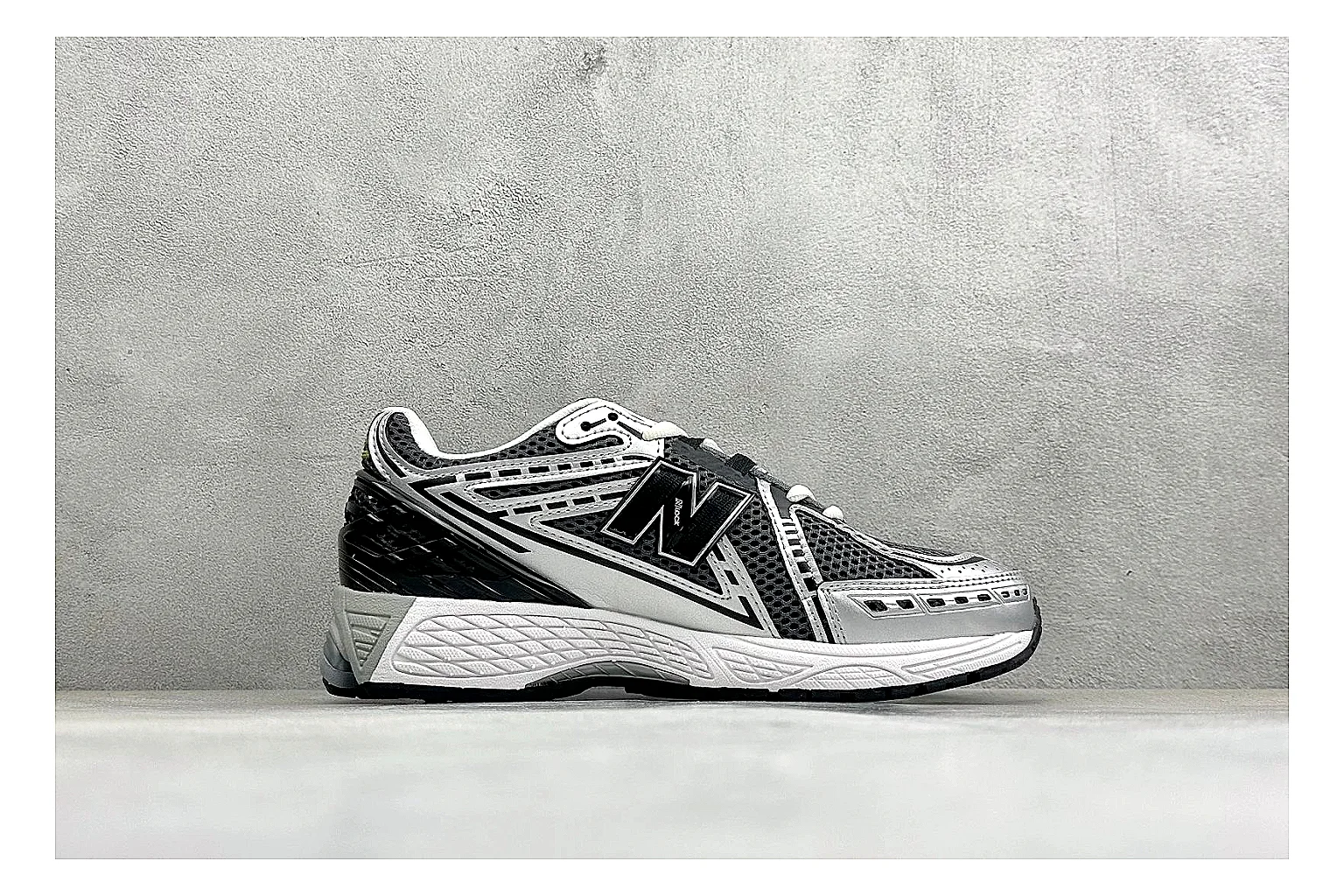 New Balance 1906 Black Silver shopping brief photo showing black mesh base, silver overlays, technical 1906 runner structure, and layered performance sole thumbnail 4