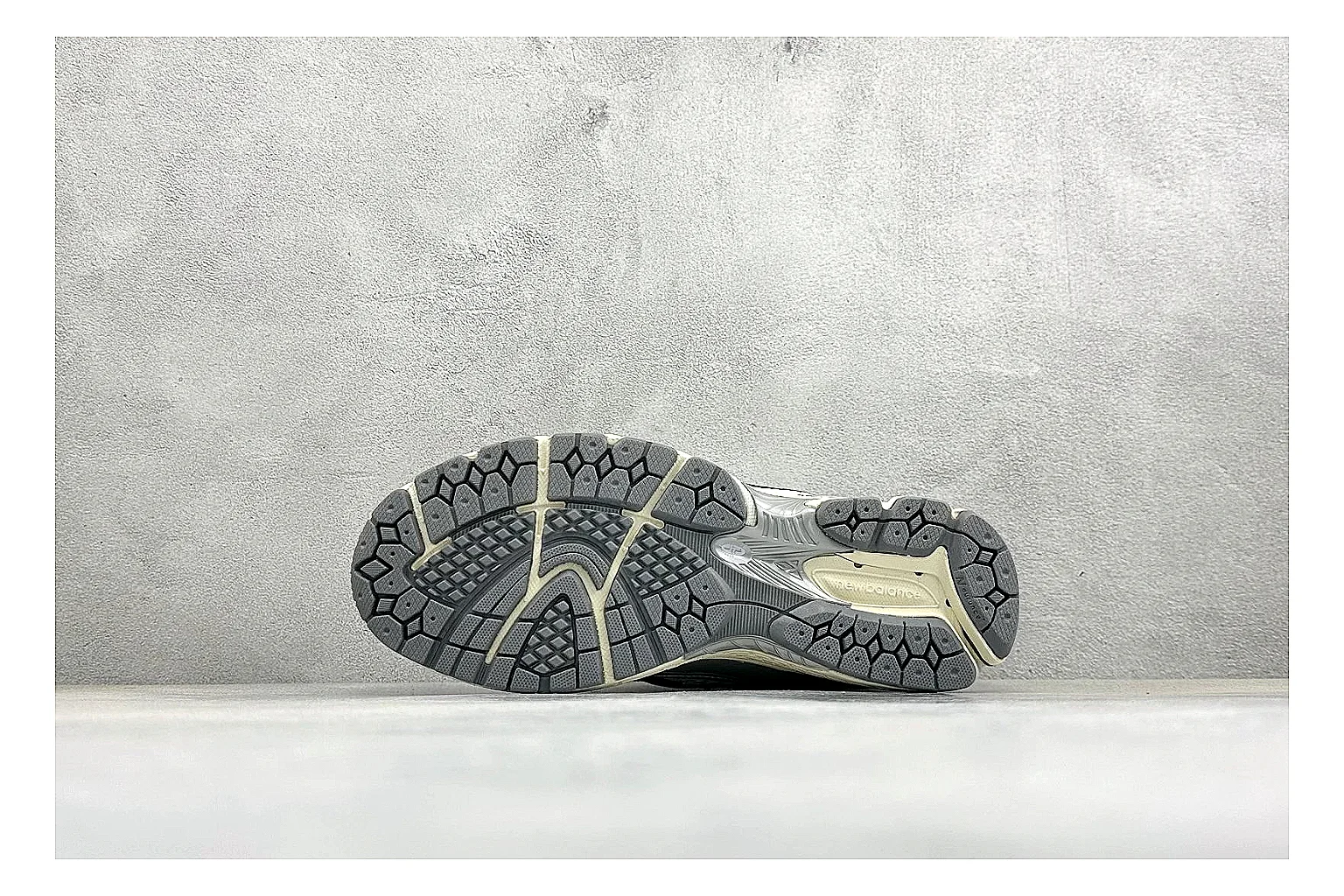 New Balance 1906 Silver Grey shopping brief image showing silver overlays, grey mesh panels, technical runner structure, and layered midsole tooling thumbnail 2