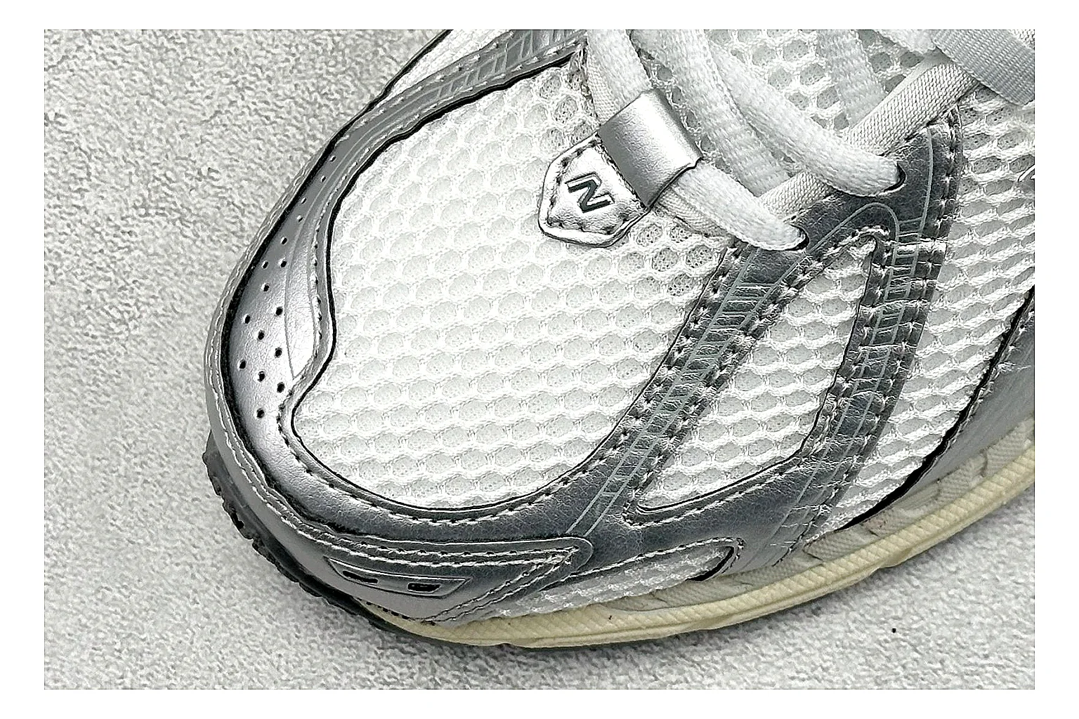 New Balance 1906 Silver Grey shopping brief image showing silver overlays, grey mesh panels, technical runner structure, and layered midsole tooling thumbnail 3