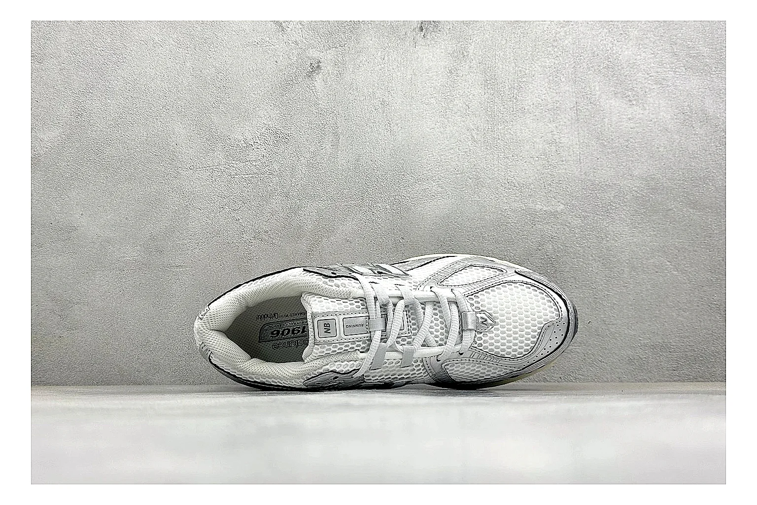 New Balance 1906 Silver Grey shopping brief image showing silver overlays, grey mesh panels, technical runner structure, and layered midsole tooling thumbnail 5