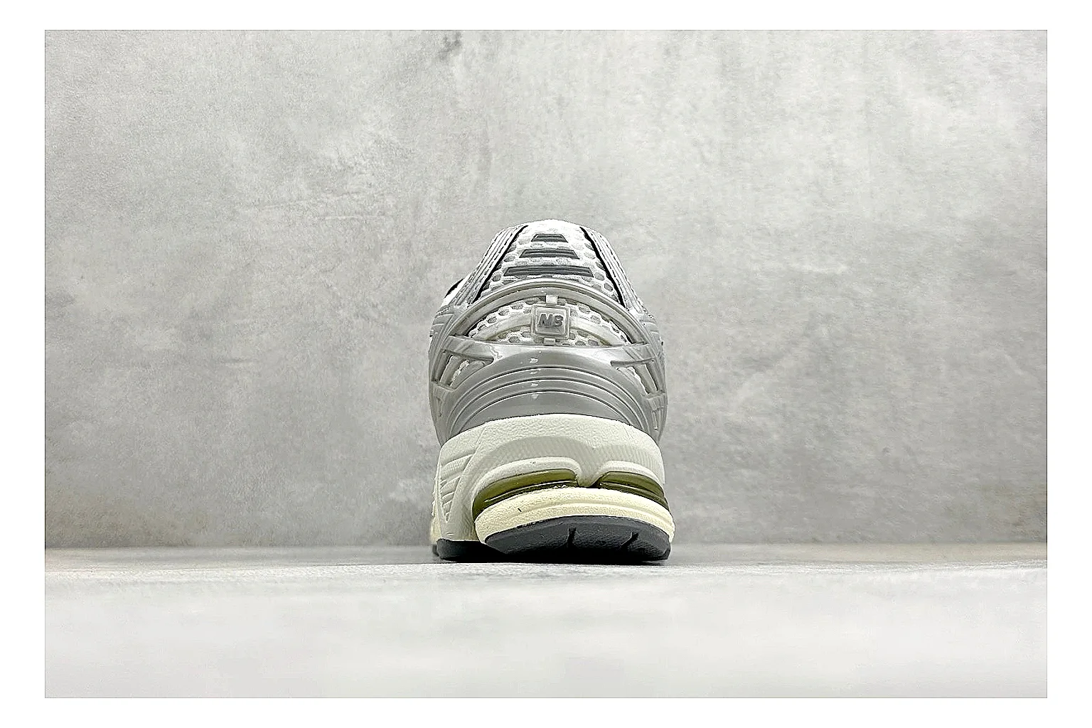 New Balance 1906 Silver Grey shopping brief image showing silver overlays, grey mesh panels, technical runner structure, and layered midsole tooling thumbnail 6