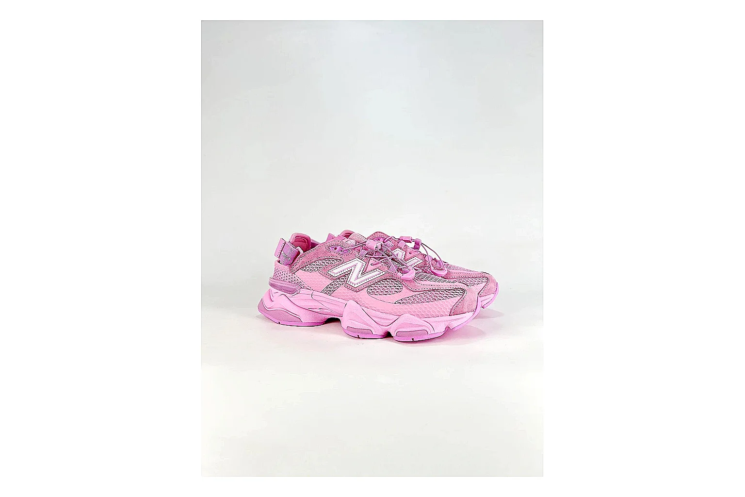 New Balance 9060 Pink Sneakers shopping brief image showing pink chunky runner sneakers with mesh-leather texture, side-profile shape, upper panel lines, and outsole detail thumbnail 4