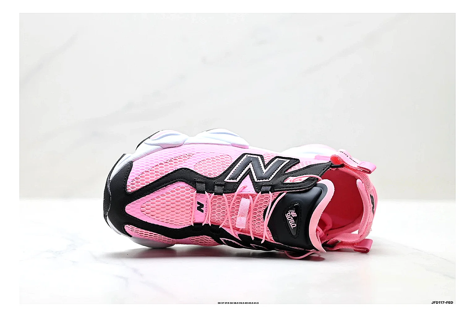New Balance 9060 Pink Black Sneakers shopping brief image showing pink black chunky runner sneakers with mesh-leather texture, side-profile shape, upper panel lines, and outsole detail thumbnail 5