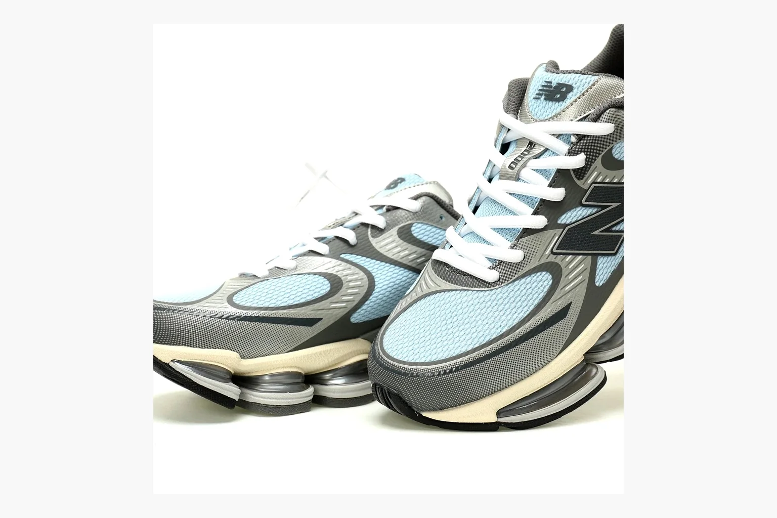 New Balance 9060 Runner Sneaker Silver Teal shopping brief image showing silver and teal NB 9060 runner with chunky sole, mesh panels, and side N logo thumbnail 3