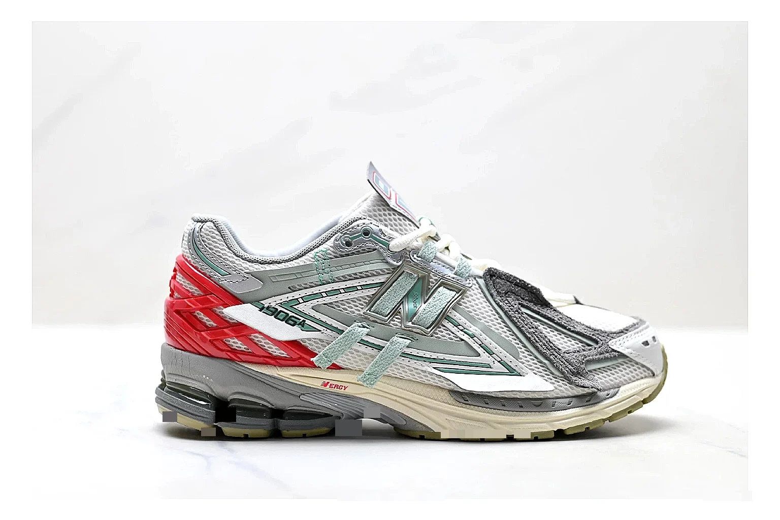 New Balance M1906 Silver Red Sneakers shopping brief image showing silver red retro runner sneakers with mesh-leather texture, side-profile shape, upper panel lines, and outsole detail