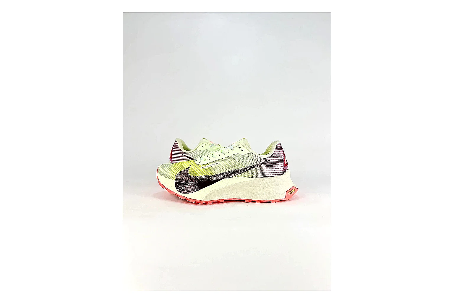 Nike ACG Ultra Lime Pink Sneakers shopping brief image showing lime pink outdoor sneakers with textile texture, side-profile shape, upper panel lines, and outsole detail