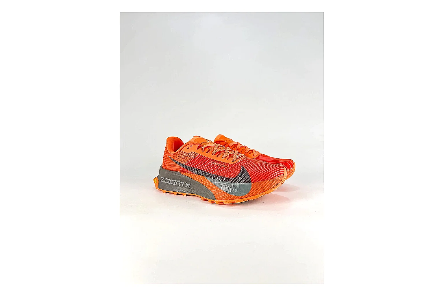 Nike ACG Ultra Orange Gray Sneakers shopping brief image showing orange gray outdoor sneakers with textile texture, side-profile shape, upper panel lines, and outsole detail thumbnail 4