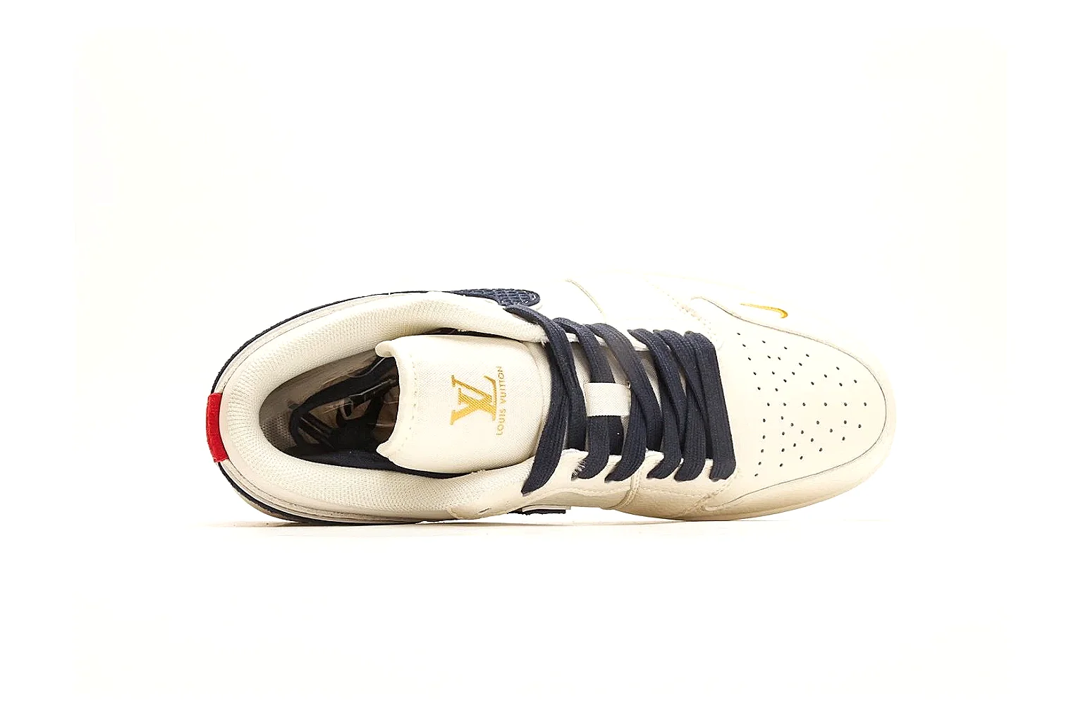 Nike Air Court Cream Navy Low Top shopping brief photo showing cream leather upper, navy Swoosh, dark laces, red heel accents, and gold side graphics thumbnail 5