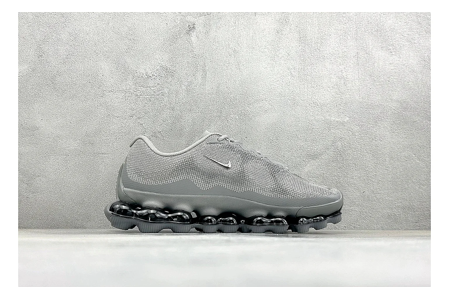 Nike Air Liquid Metal Silver shopping brief image showing reflective silver upper, running-inspired panels, sculpted pod outsole, and glossy tech finish thumbnail 4