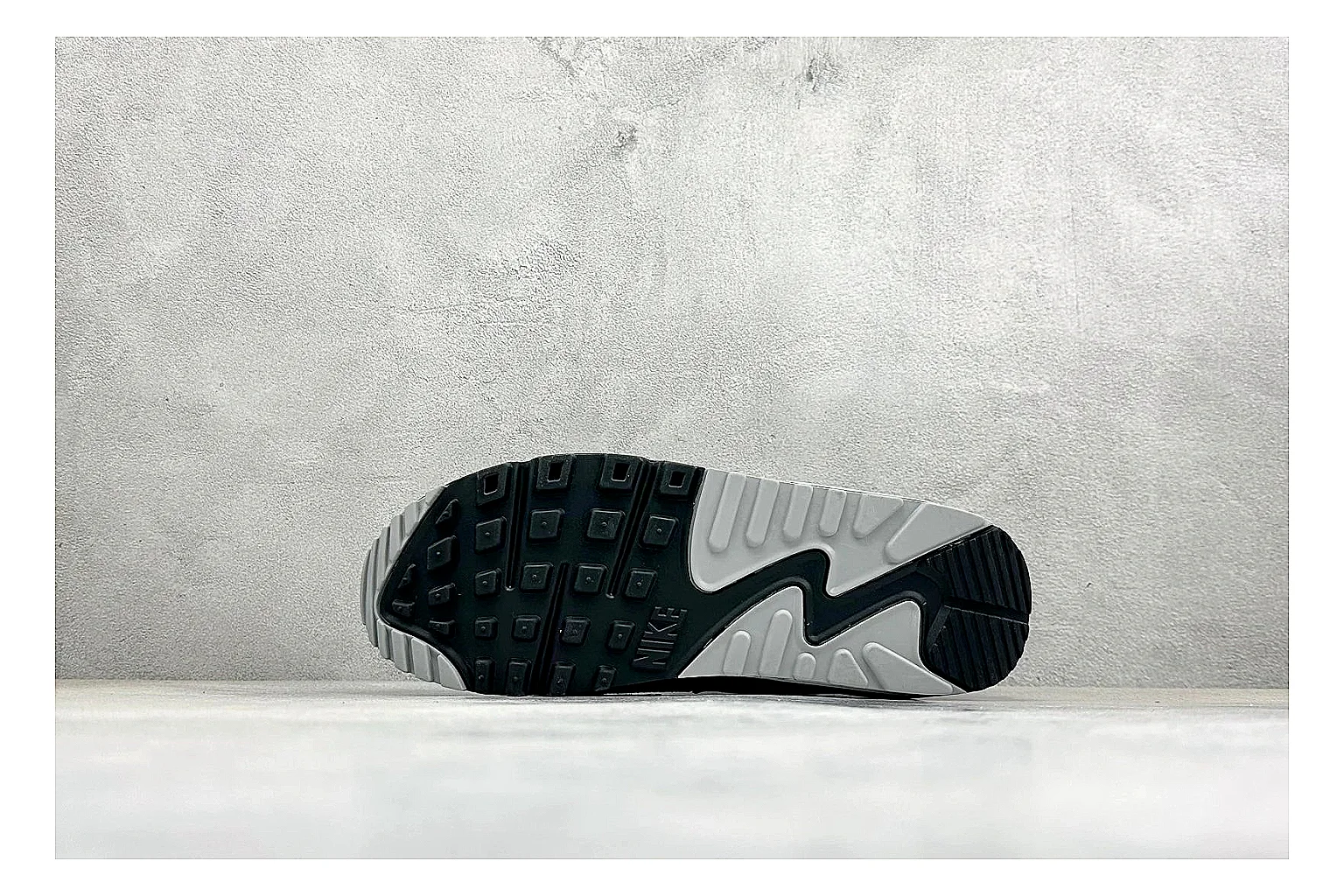 Nike Air Max 90 Grey Black shopping brief photo showing grey and black layered upper, visible Air window, classic Air Max 90 panels, and sturdy retro sole thumbnail 2