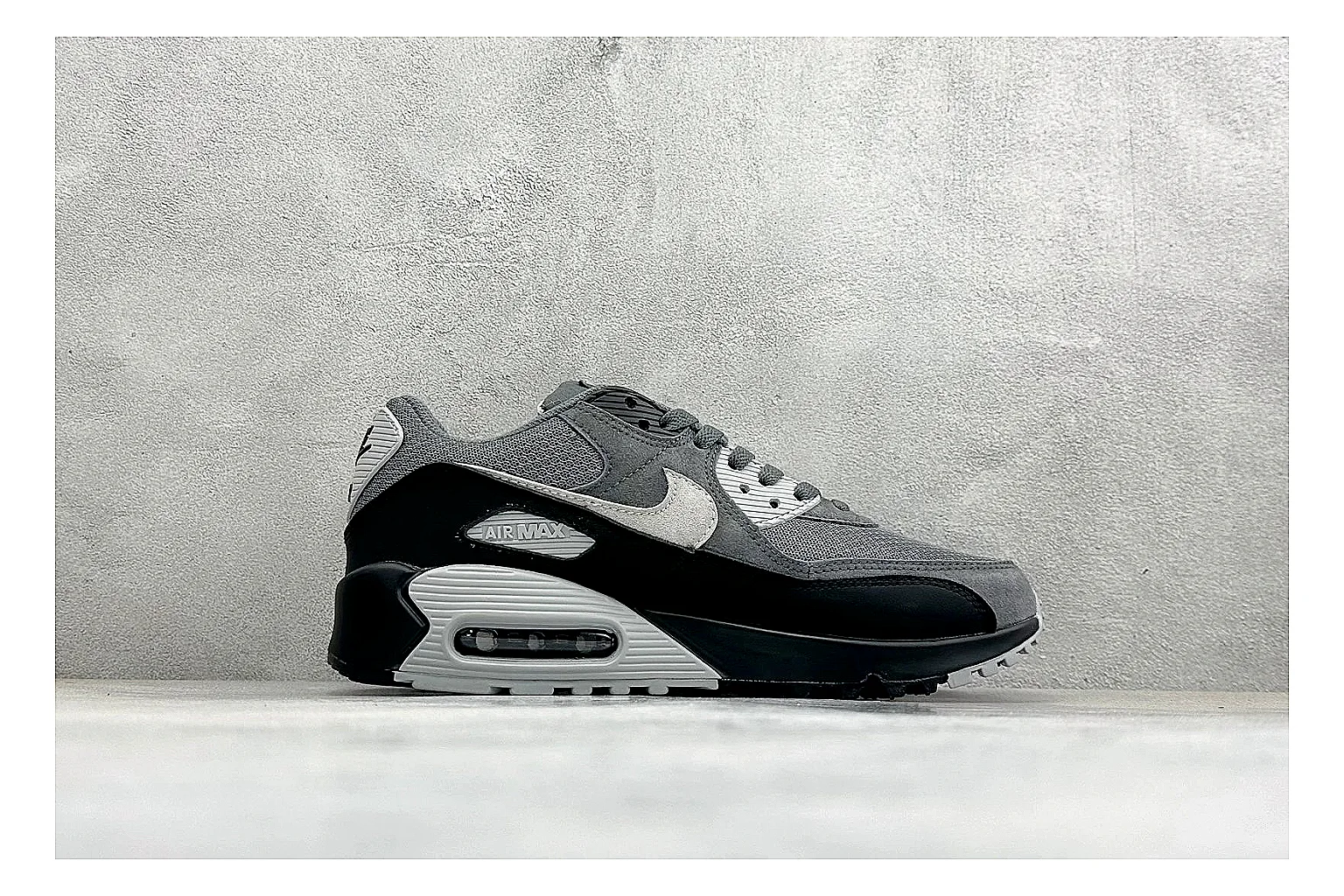 Nike Air Max 90 Grey Black shopping brief photo showing grey and black layered upper, visible Air window, classic Air Max 90 panels, and sturdy retro sole thumbnail 4