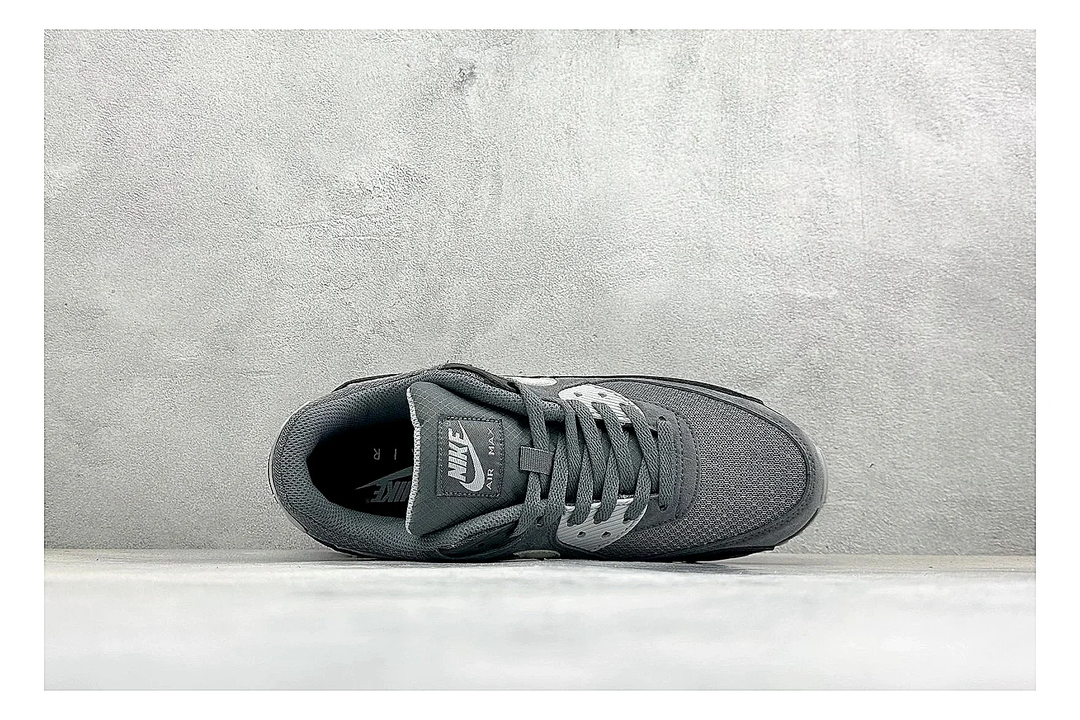 Nike Air Max 90 Grey Black shopping brief photo showing grey and black layered upper, visible Air window, classic Air Max 90 panels, and sturdy retro sole thumbnail 5