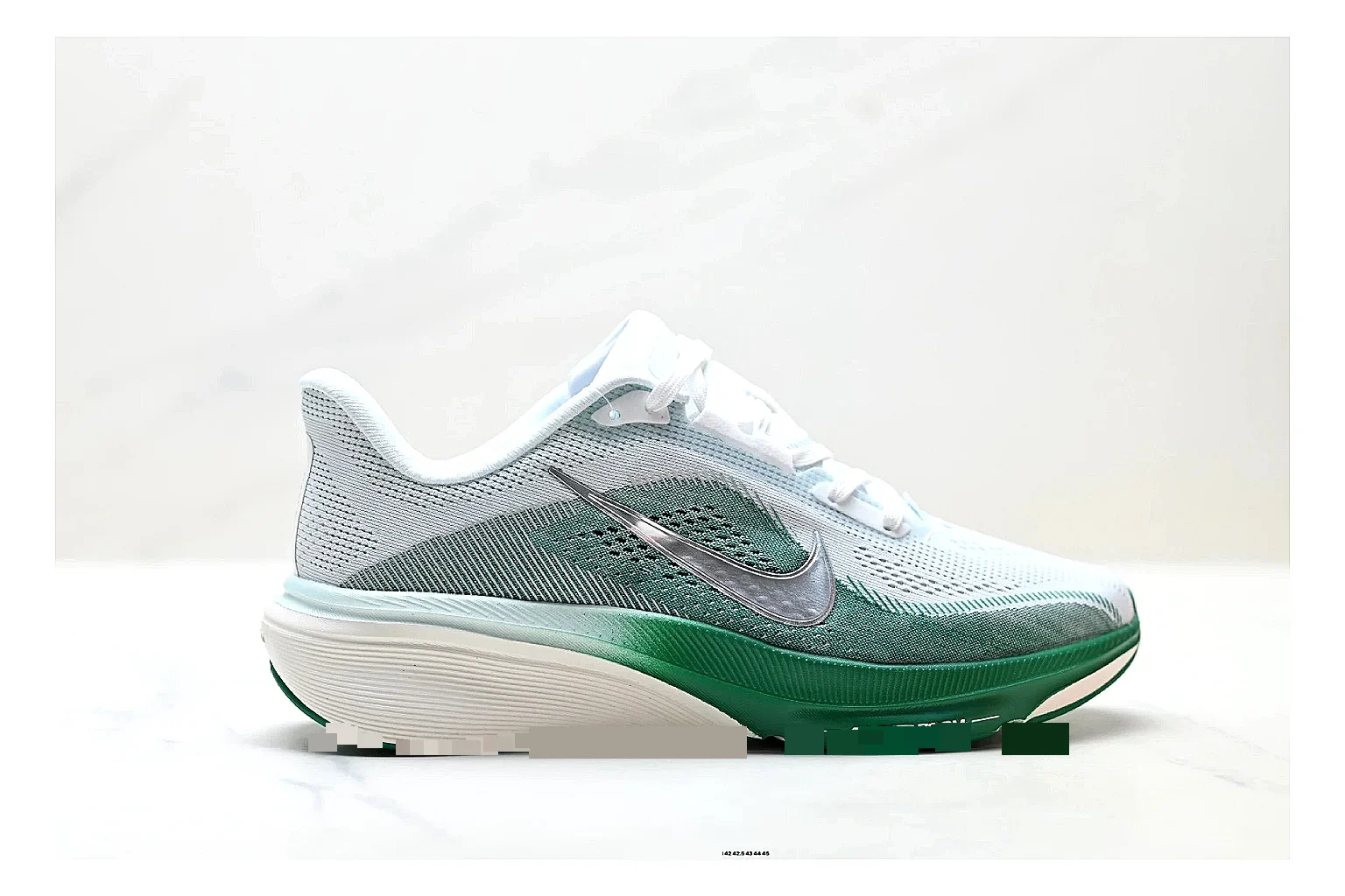 Nike Air Zoom Pegasus White Green Sneakers shopping brief image showing white green running sneakers with mesh texture, side-profile shape, upper panel lines, and outsole detail