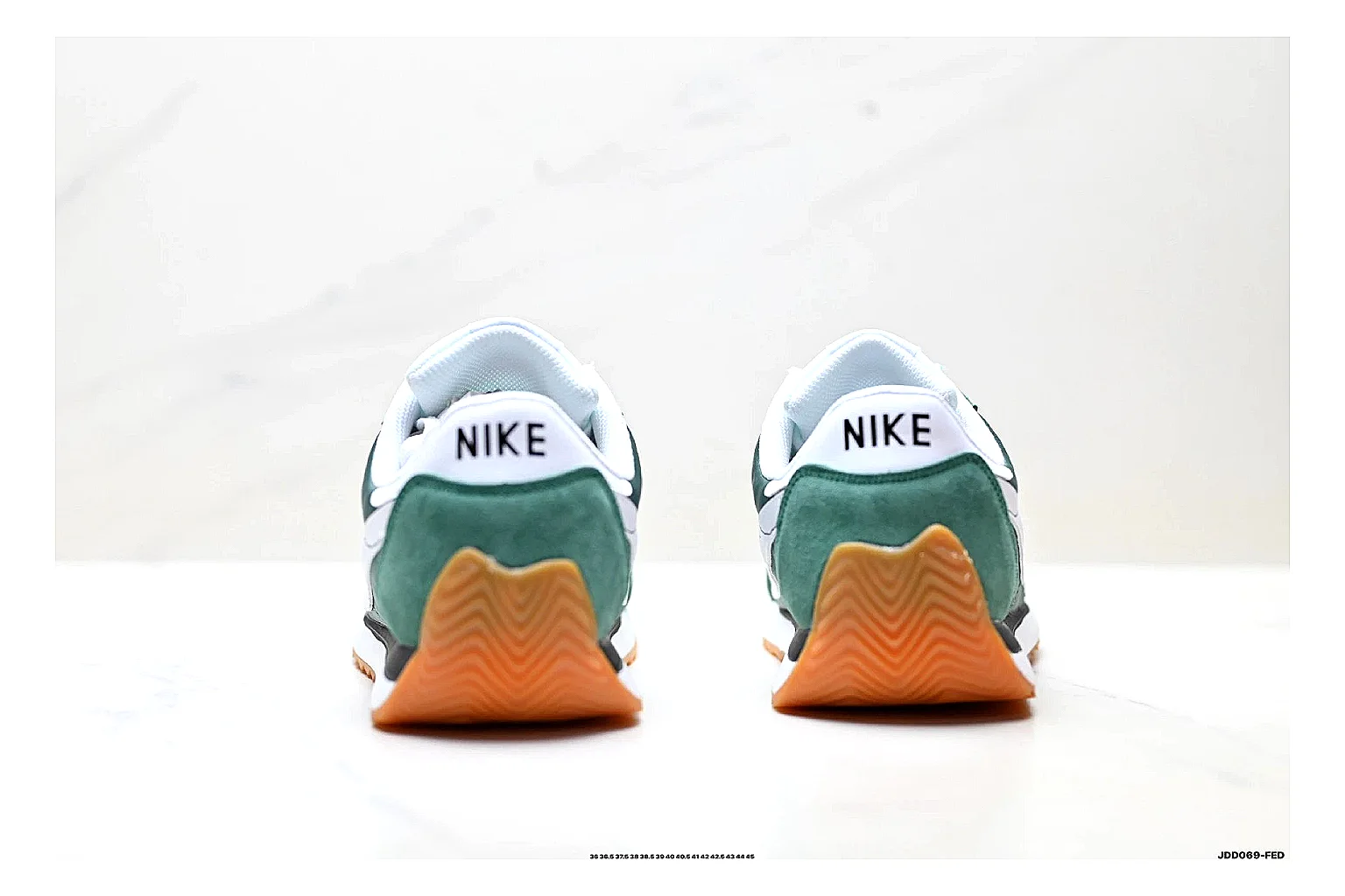 Nike Cortez Green White shopping brief photo showing green white leather low-top upper, slim retro runner profile, Swoosh detail, and classic Cortez sole thumbnail 6