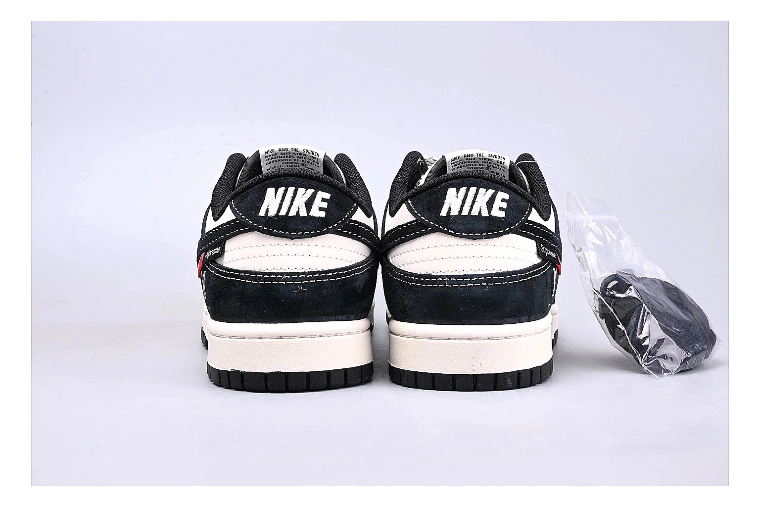 Nike Dunk Low Black White shopping brief photo showing black and white leather panels, low Dunk silhouette, padded collar, and basketball-retro sole thumbnail 2