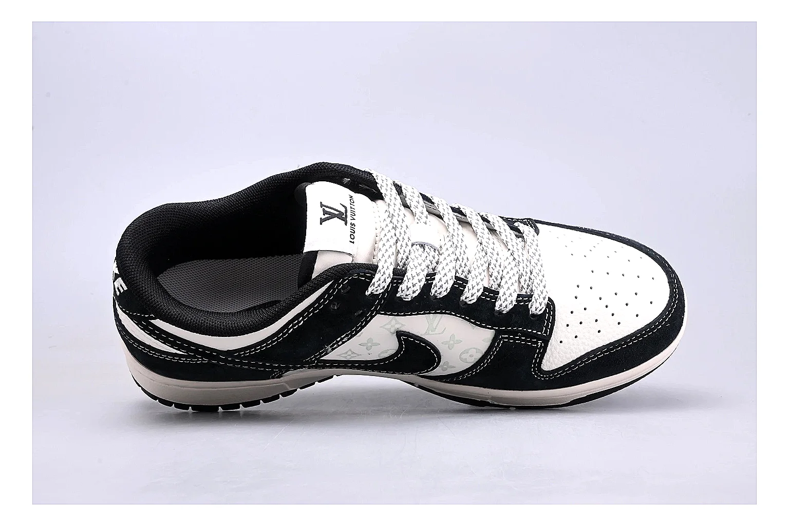 Nike Dunk Low Black White shopping brief photo showing black and white leather panels, low Dunk silhouette, padded collar, and basketball-retro sole thumbnail 5