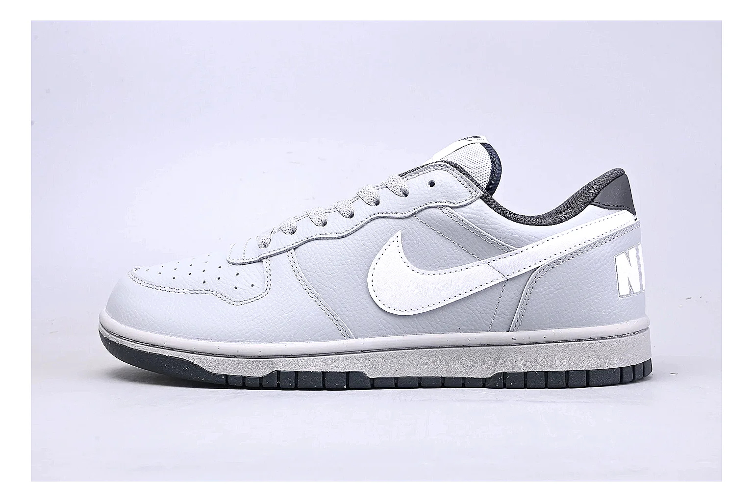 Nike Dunk Low White Gray shopping brief photo showing white and gray leather panels, low Dunk shape, padded collar, and basketball-retro sole