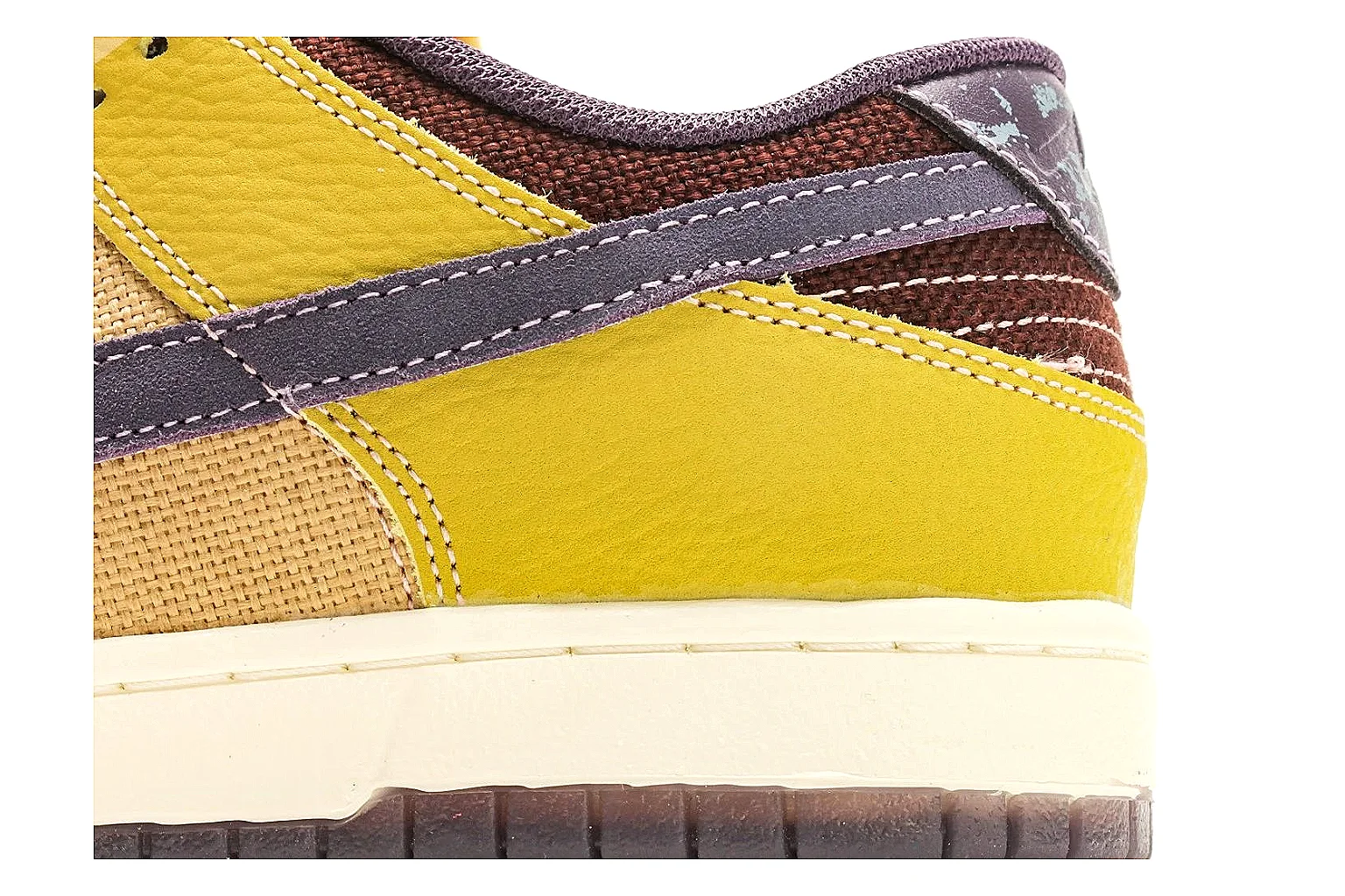 Nike Dunk Low Yellow Purple shopping brief photo showing yellow and purple leather panels, dark Swoosh, heel overlay, cream midsole, and brown outsole thumbnail 3