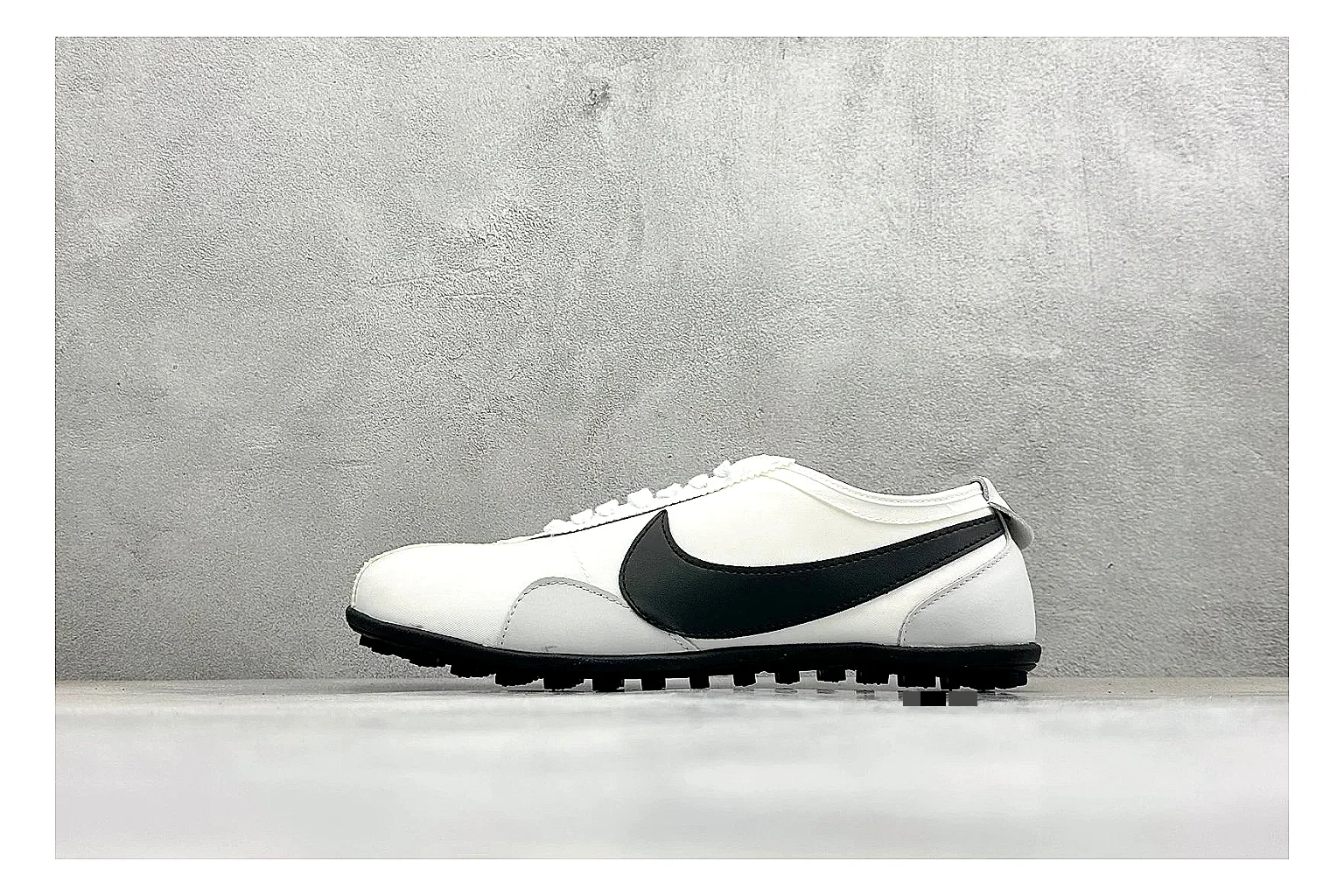Nike Moon Shoe OG White Black shopping brief image showing white upper, black Swoosh, slim retro runner shape, and waffle-style outsole