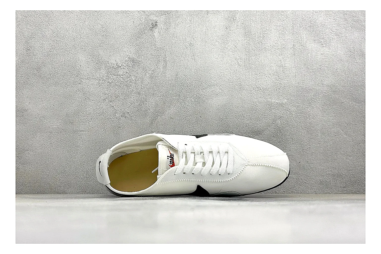Nike Moon Shoe OG White Black shopping brief image showing white upper, black Swoosh, slim retro runner shape, and waffle-style outsole thumbnail 5