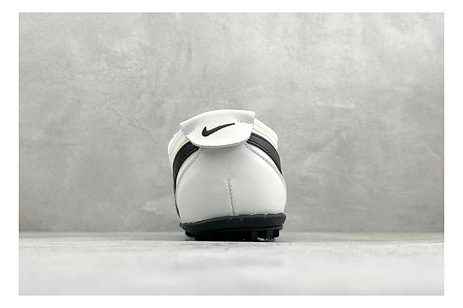 Nike Moon Shoe OG White Black shopping brief image showing white upper, black Swoosh, slim retro runner shape, and waffle-style outsole thumbnail 6