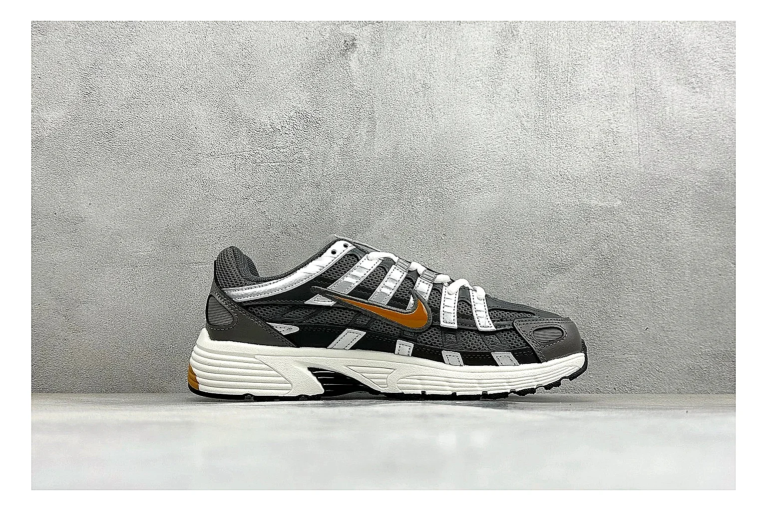 Nike P-6000 Black Orange shopping brief photo showing black layered runner upper, orange accent hits, retro P-6000 paneling, and cushioned casual sole thumbnail 4