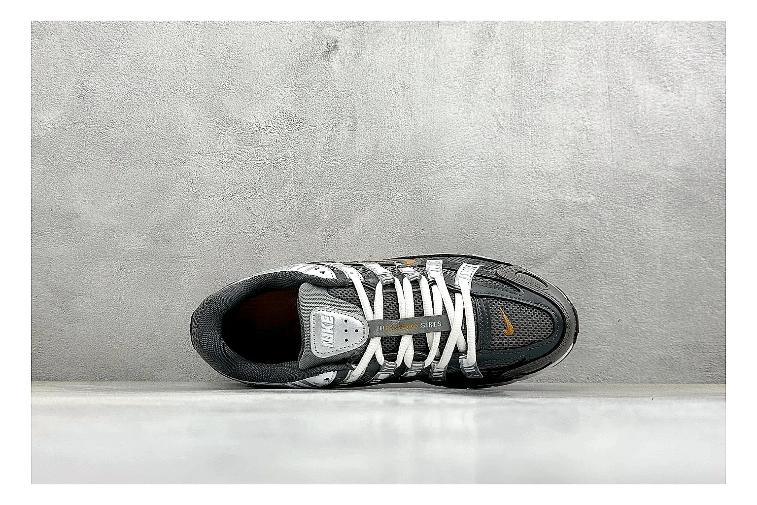 Nike P-6000 Black Orange shopping brief photo showing black layered runner upper, orange accent hits, retro P-6000 paneling, and cushioned casual sole thumbnail 5