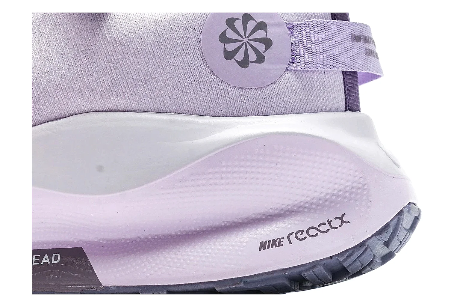 Nike ReactX GORE-TEX Lilac Sneakers shopping brief photo showing lilac textile upper, small Swoosh, heel pull tabs, cushioned ReactX-style sole, and weather-ready low profile thumbnail 3
