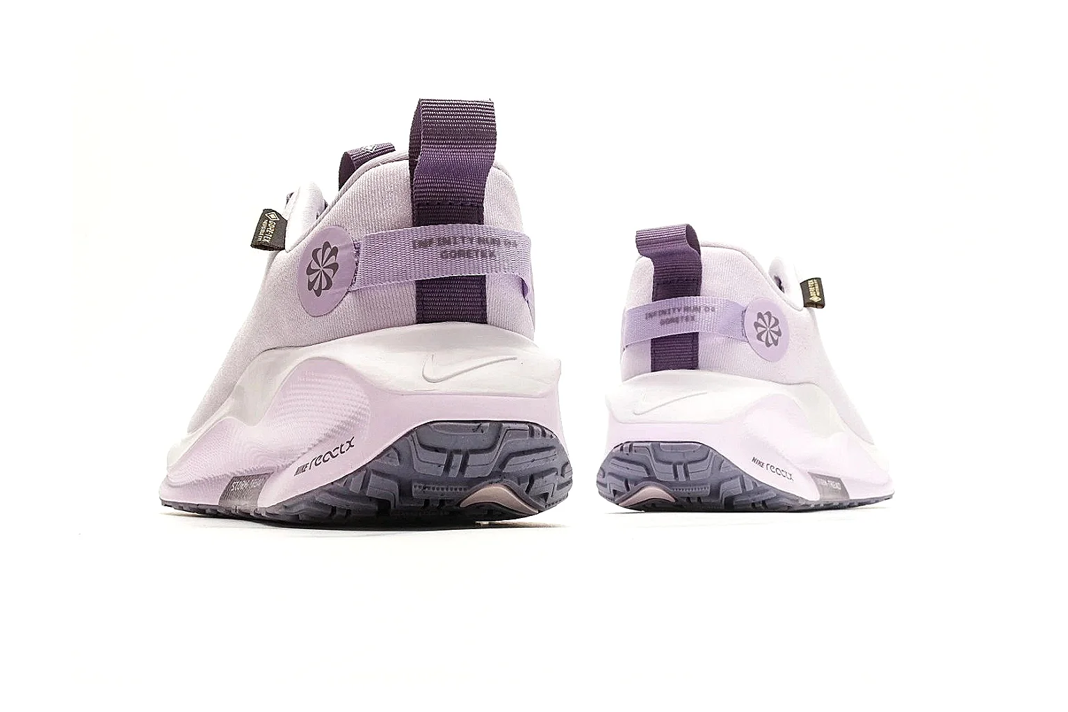 Nike ReactX GORE-TEX Lilac Sneakers shopping brief photo showing lilac textile upper, small Swoosh, heel pull tabs, cushioned ReactX-style sole, and weather-ready low profile thumbnail 6