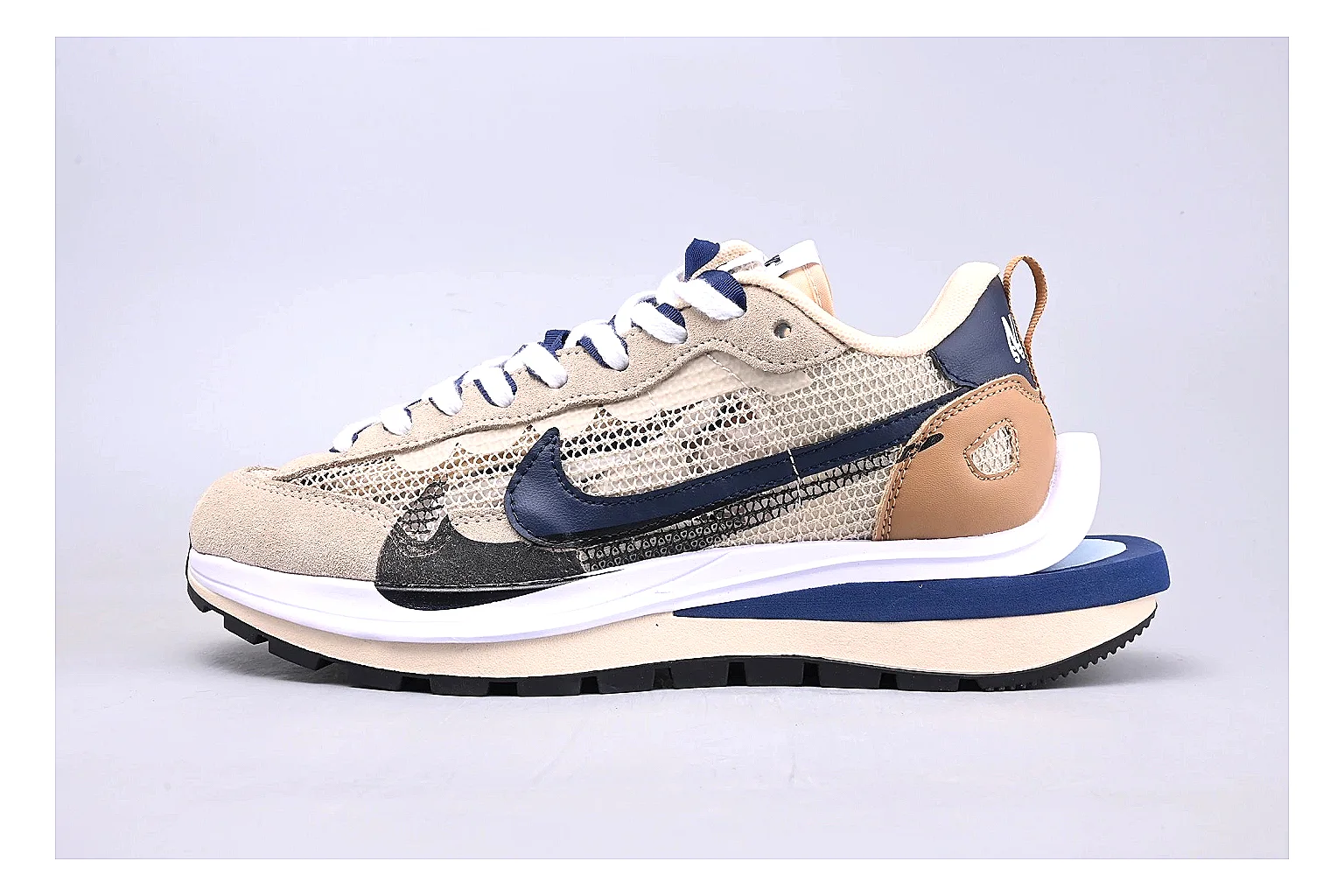 Nike Retro Runner Beige Blue shopping brief photo showing beige suede-mesh runner upper, blue accent panels, low retro profile, and cushioned running sole