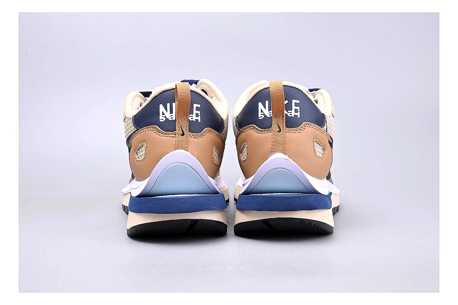Nike Retro Runner Beige Blue shopping brief photo showing beige suede-mesh runner upper, blue accent panels, low retro profile, and cushioned running sole thumbnail 2