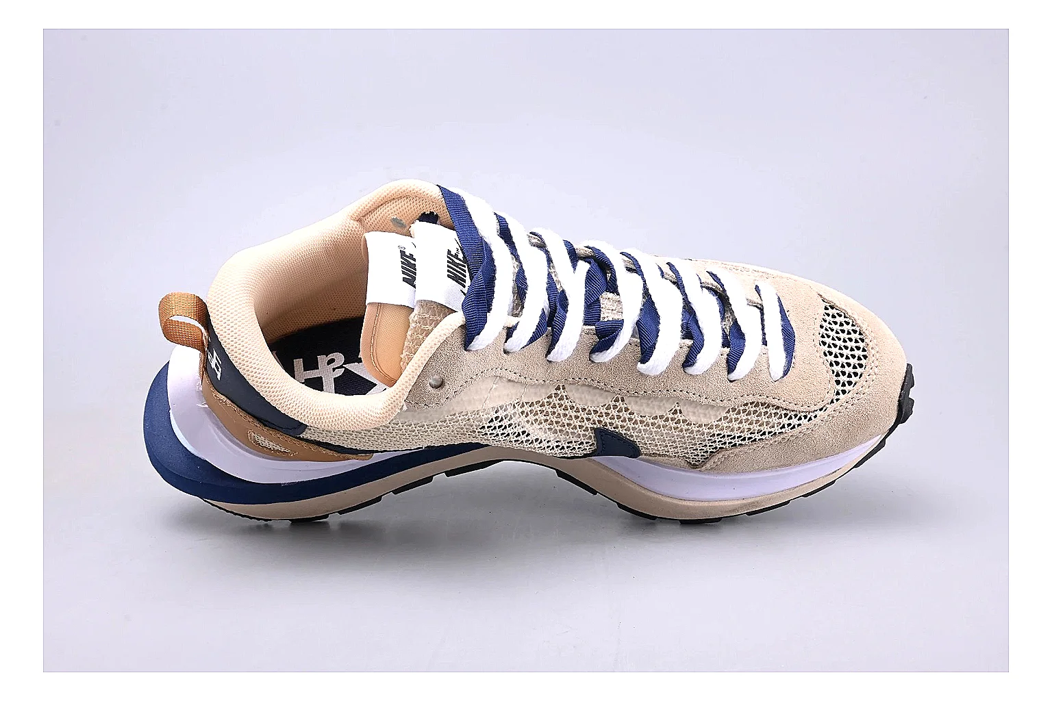 Nike Retro Runner Beige Blue shopping brief photo showing beige suede-mesh runner upper, blue accent panels, low retro profile, and cushioned running sole thumbnail 5