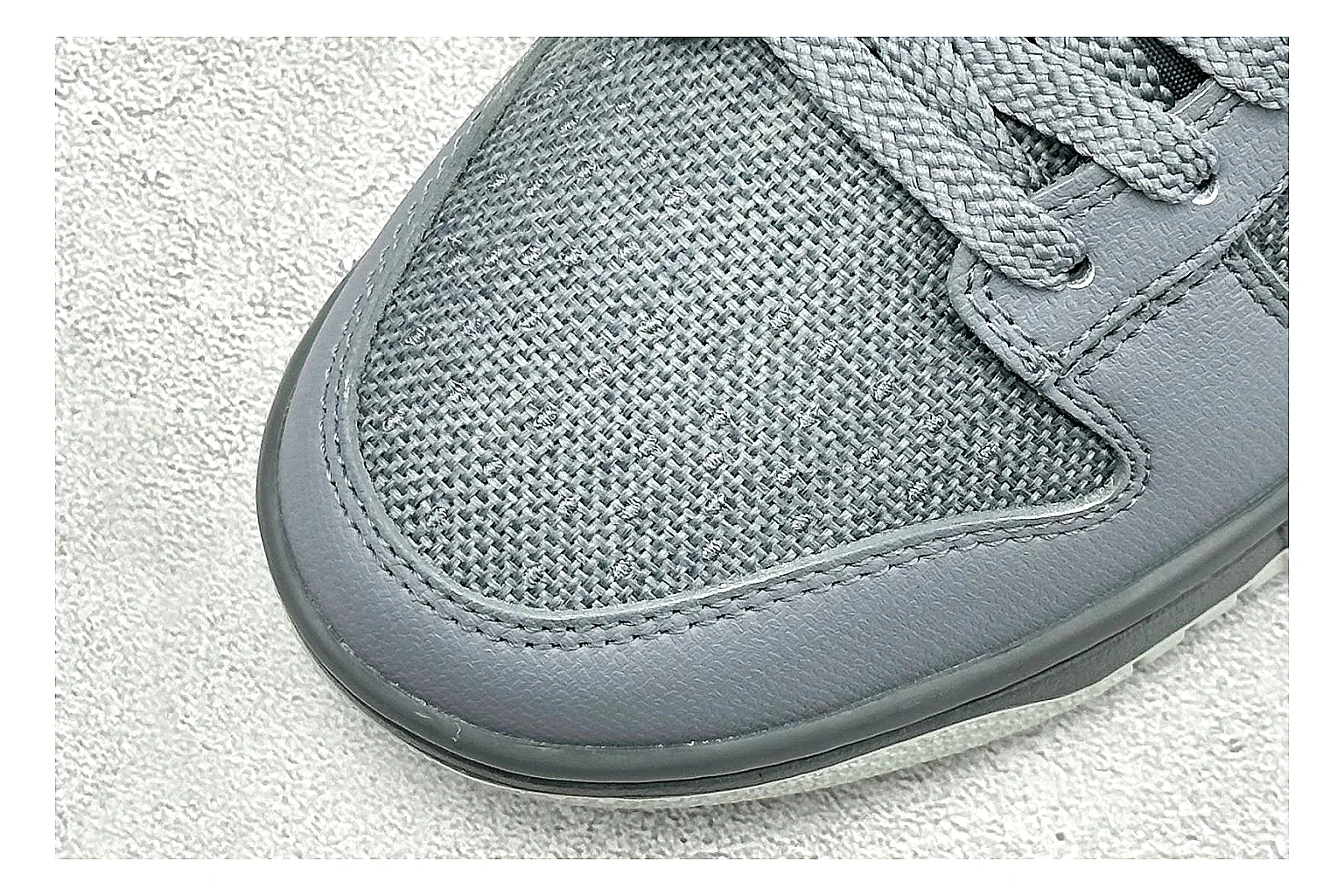 Nike SB Dunk Low Grey shopping brief photo showing grey low-top skate upper, white Swoosh, padded collar, and classic Dunk sole thumbnail 3