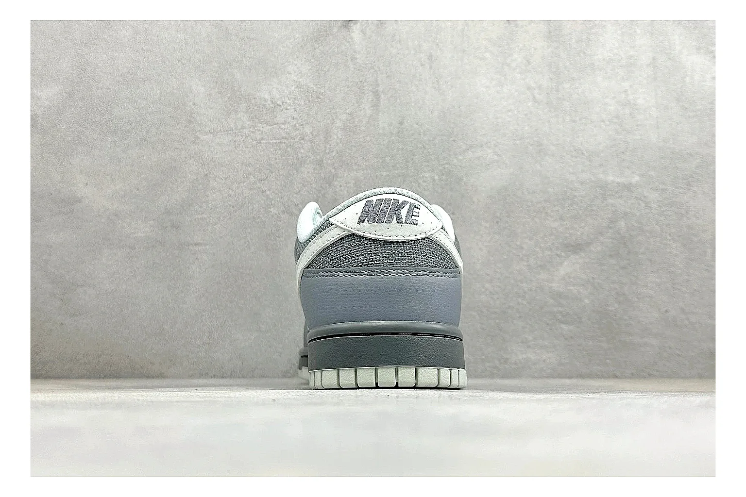 Nike SB Dunk Low Grey shopping brief photo showing grey low-top skate upper, white Swoosh, padded collar, and classic Dunk sole thumbnail 6